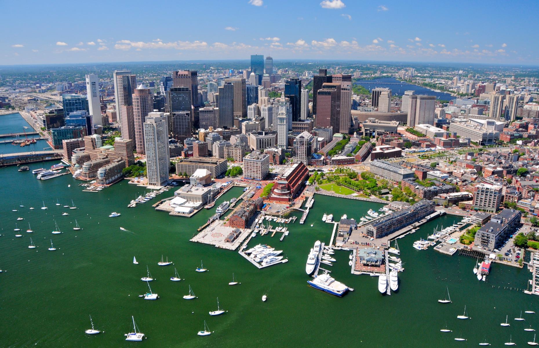 Slide 37 of 45: The city of Boston is best-known for its rich history but it's not lacking in head-turning views either. This aerial shot takes in the city's vast harbor, its waters dotted with boats and fringed by skyscrapers. From the air, you can also appreciate how green Massachusetts' capital really is, with trees peeping from between the buildings and vast parks breaking up the glass and gray. 