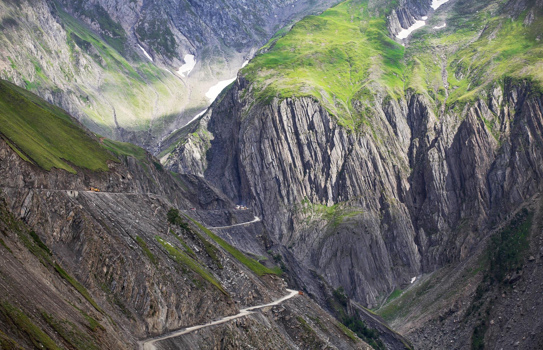 <p>Drivers must contend with extreme weather conditions and an extremely narrow and steep route on this hazardous road between Ladakh and Kashmir in India. As well as strong winds and landslides, there are no barriers to prevent vehicles from plunging down the steep gorge. The pass, which climbs to 11,500 feet (3,000m) above sea level on the edge of the Himalayas, is part of National Highway 1, which goes between Srinagar and Leh. </p>