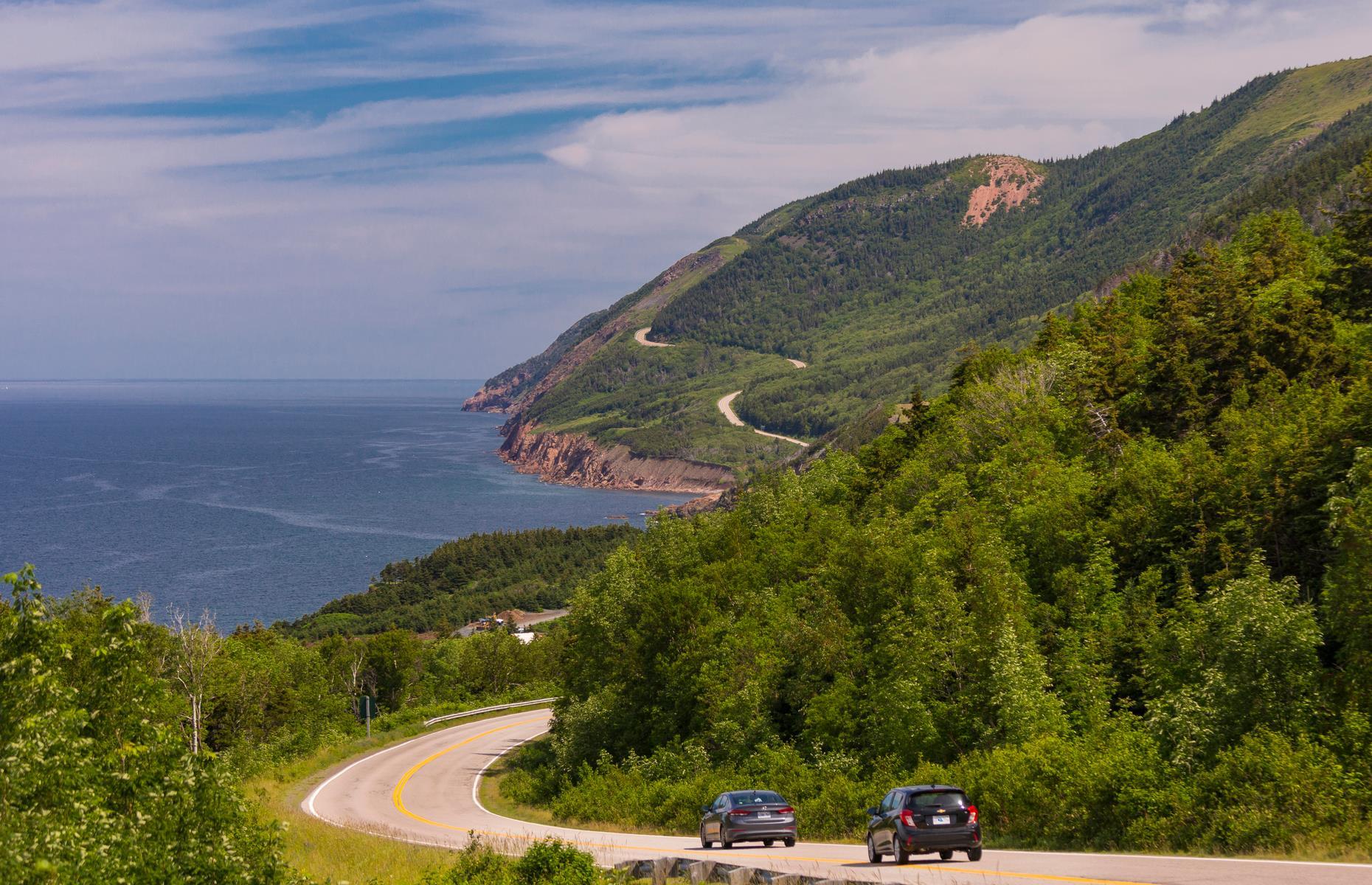 <p>Looping around Cape Breton Island in Nova Scotia, this famous 185-mile (298km) route delivers dramatic coastal and highland scenery and all-round thrilling driving terrain. Start at Baddeck and go east or west to see the island's natural beauty flit by your window. Highlights include Cape Breton Highlands National Park and Pleasant Bay, a top whale watching spot. These <a href="https://www.loveexploring.com/galleries/78646/50-photos-that-will-make-you-fall-in-love-with-canada?page=1">50 photos are sure to make you fall in love with Canada</a>.</p>