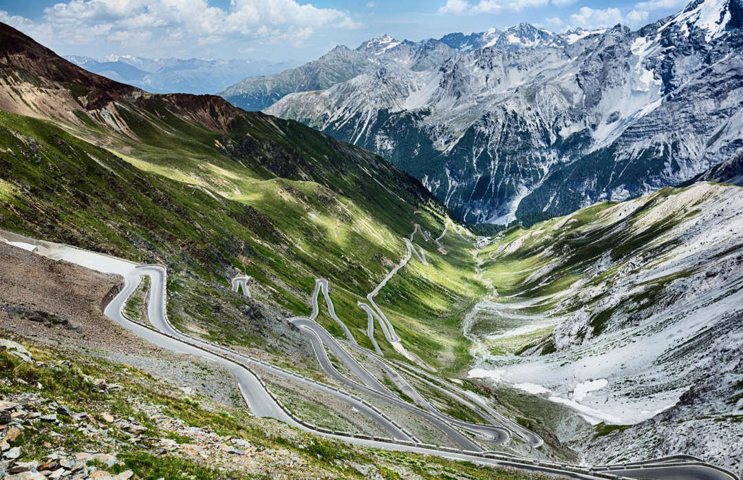 Slide 3 of 44: Cyclists, motorbikers and motorists alike laud this infamous mountain pass in the Italian alps near the Swiss border as one of the ultimate roads. At just over 9,000 feet (2,743m), Stelvio Pass is the second highest mountain pass in the Alps. But it's the 48 hairpin turns that make it the most amazing. The original road dates back to the 1820s. It's open between May and November.