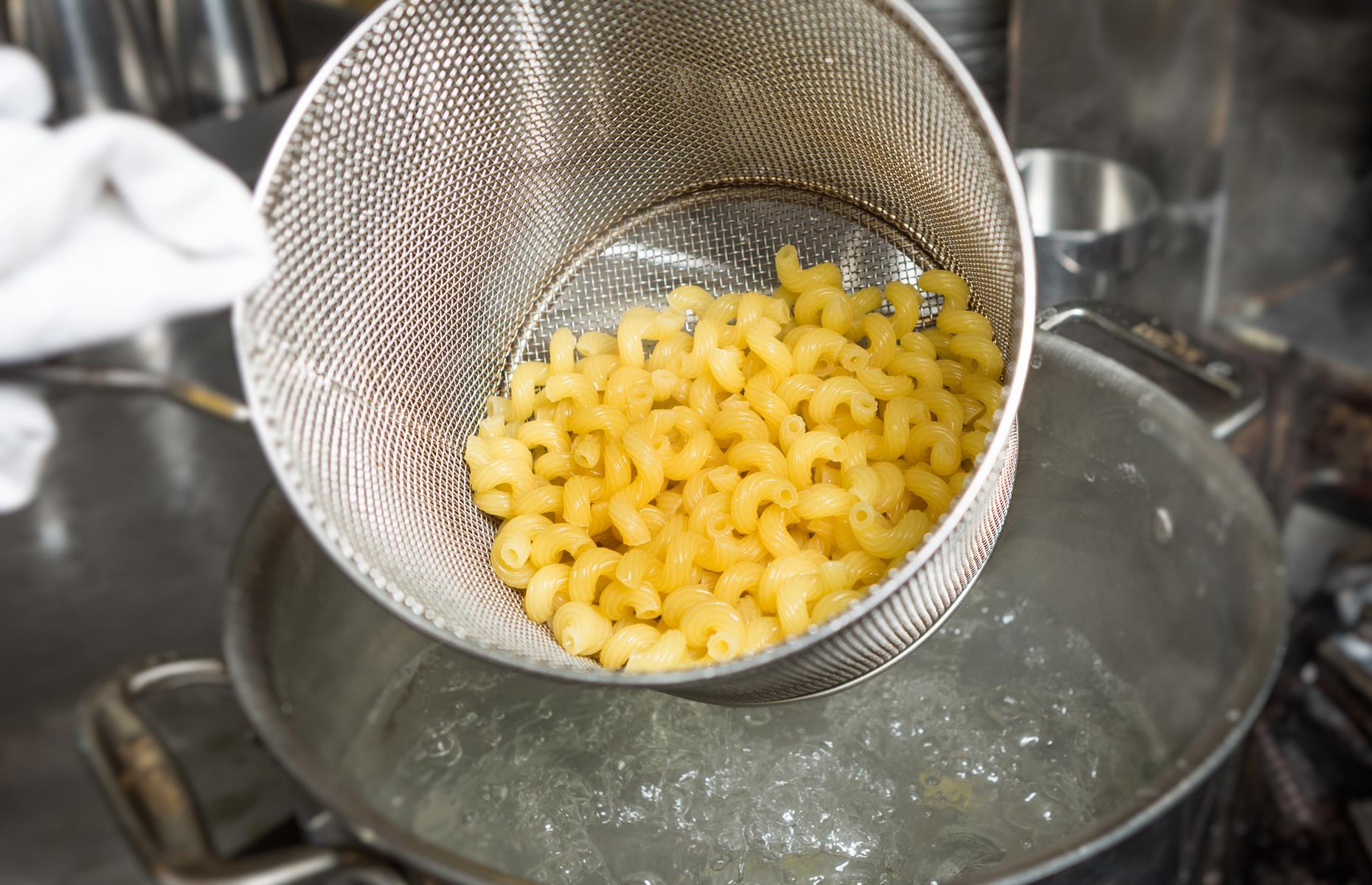 Macaroni should be cooked in a large pan of boiling salted water for around eight minutes (though packet instructions vary). It's smaller than some pasta shapes, so you won’t need long if you're aiming for al dente, which is firm cooked pasta.