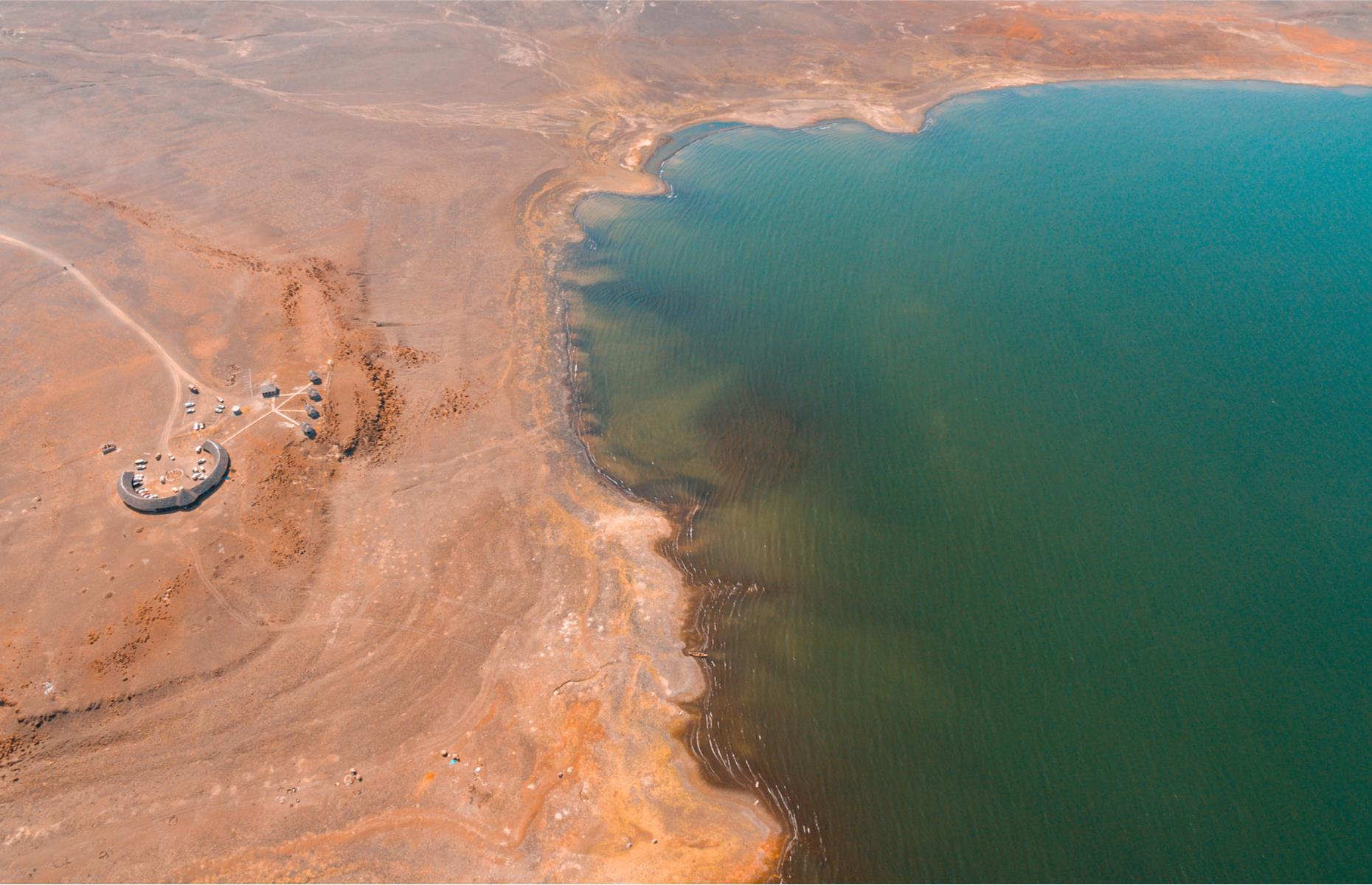 Slide 20 of 53: The inland sea of Lake Turkana, the largest desert lake in the world, is longer than Kenya’s coastline. Often known as the Jade Sea because of its remarkable color, the lake is a stopover for migrant waterfowl and an important breeding ground for the Nile crocodile, hippopotamus and many venomous snakes. It was inscribed on the UNESCO World Heritage List in 1997, but with concerns over the impact of a dam on the lake’s flow and ecosystem, it was added to the danger list in 2018.