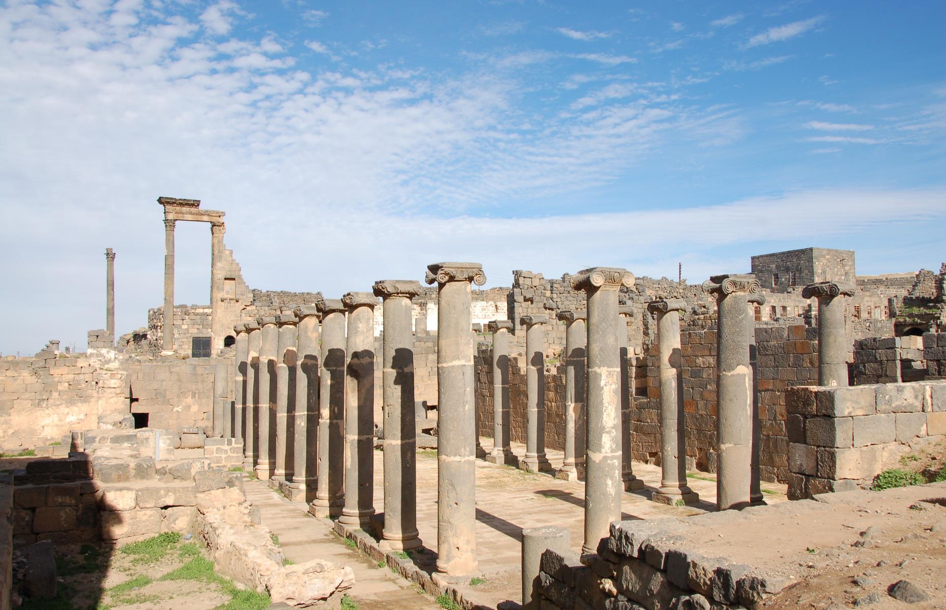 Slide 41 of 53: This ancient city was once the capital of the Roman province of Arabia and a stopover for pilgrims on the ancient caravan route to Mecca. The site included a magnificent 2nd-century Roman theater, early Christian ruins and several mosques. As a result of the ongoing civil war, fighting has caused irreparable damage to much of this precious historical site.