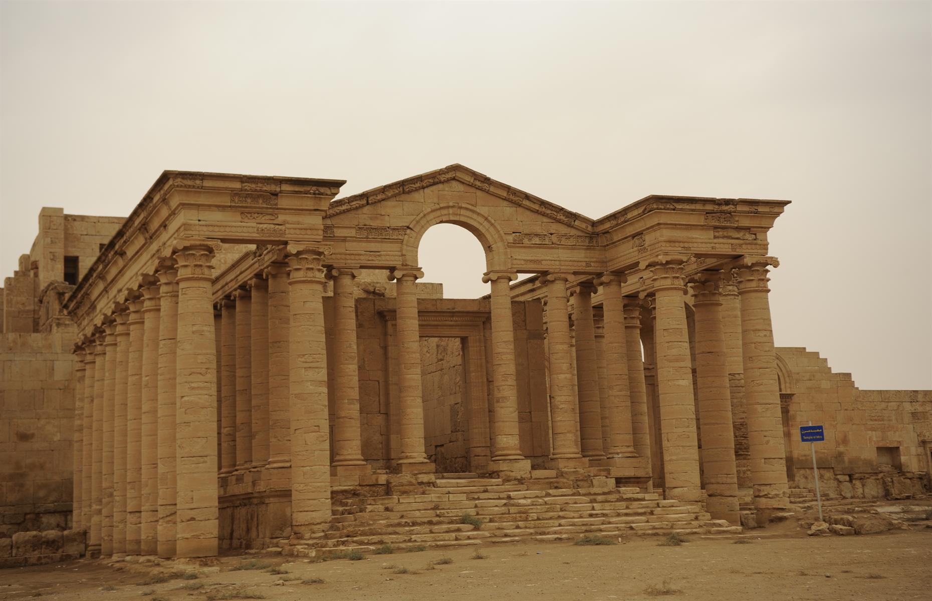 Slide 17 of 53: The fortress city of Hatra, which dates back to days of the Parthian empire in the 3rd or 2nd century BC, was the capital of the first Arab Kingdom. Known for its mighty walls and towers, which helped it withstand two Roman invasions in the 2nd century AD, its architecture represents a unique blend of Hellenistic and Roman styles with eastern decorative features. It was taken by Isis in 2015, who used sledgehammers and guns to destroy carvings and statues. It is undergoing a lengthy restoration process.