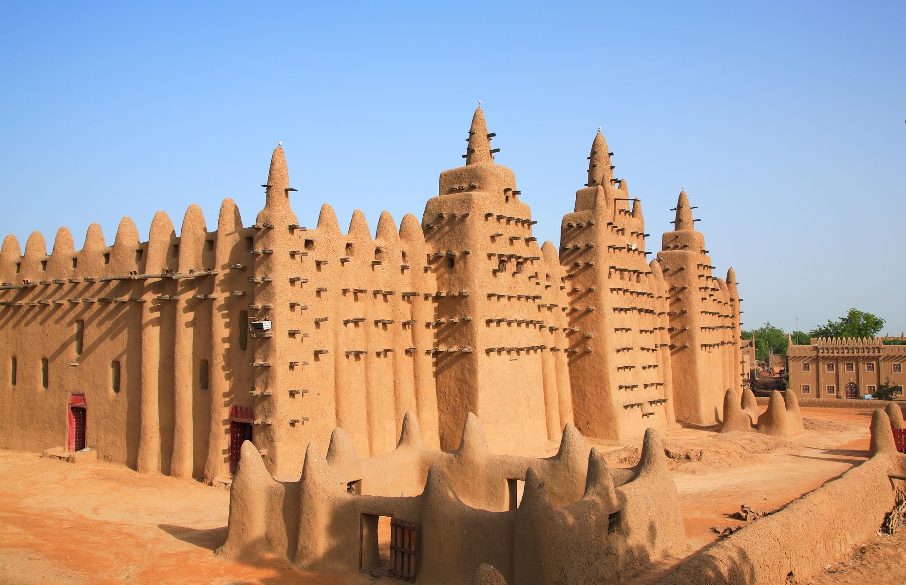 Slide 27 of 53: One of the oldest towns of sub-Saharan Africa, the Old Town of Djenné has been inhabited since 250 BC. It became an important link in the trans-Saharan gold trade and was one of the centers for the propagation of Islam in the 15th and 16th centuries. Nearly 2,000 of its original mud-walled houses have survived. Its mosque and other historic buildings were designated a World Heritage Site in 1988 for being representative of Islamic architecture in sub-Saharan Africa. It was inscribed on the danger list in 2016 due to insecurity affecting the area.