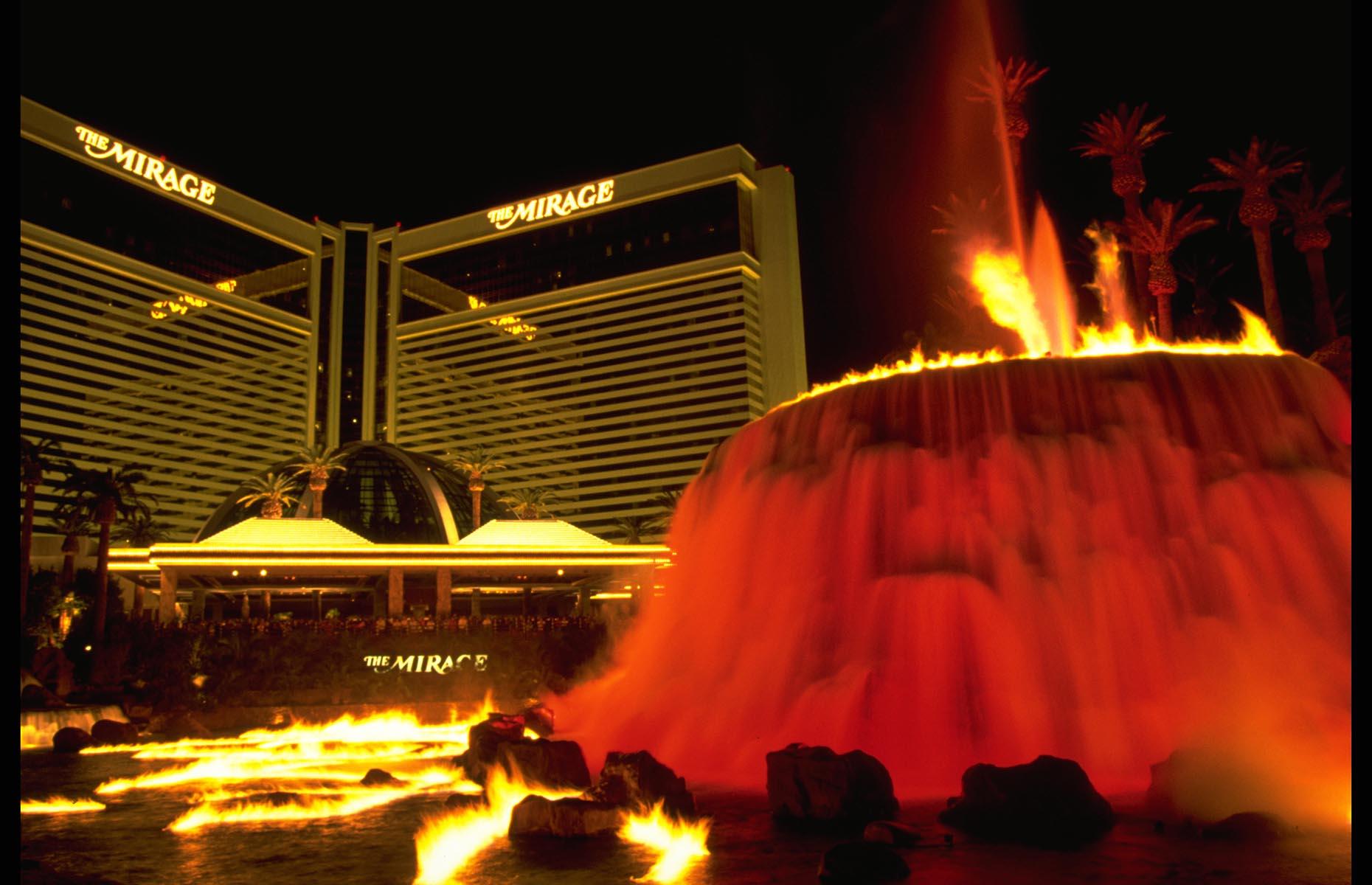 Slide 26 of 34: What Las Vegas needed was a new exciting hotel and that came in the form of Polynesian-themed The Mirage. The sparkling exterior featured five-story waterfalls, lagoons, tropical foliage and a volcano that erupted regularly. The 3,044-room hotel was the largest in the world at the time and its top five floors were used exclusively for high-roller games and penthouse suites. The first hotel to be built on the Strip in 16 years, The Mirage went all out and signed Siegfried & Roy to create the most spellbinding illusionist headline show that Las Vegas had ever seen. These are the most historic hotels in America.