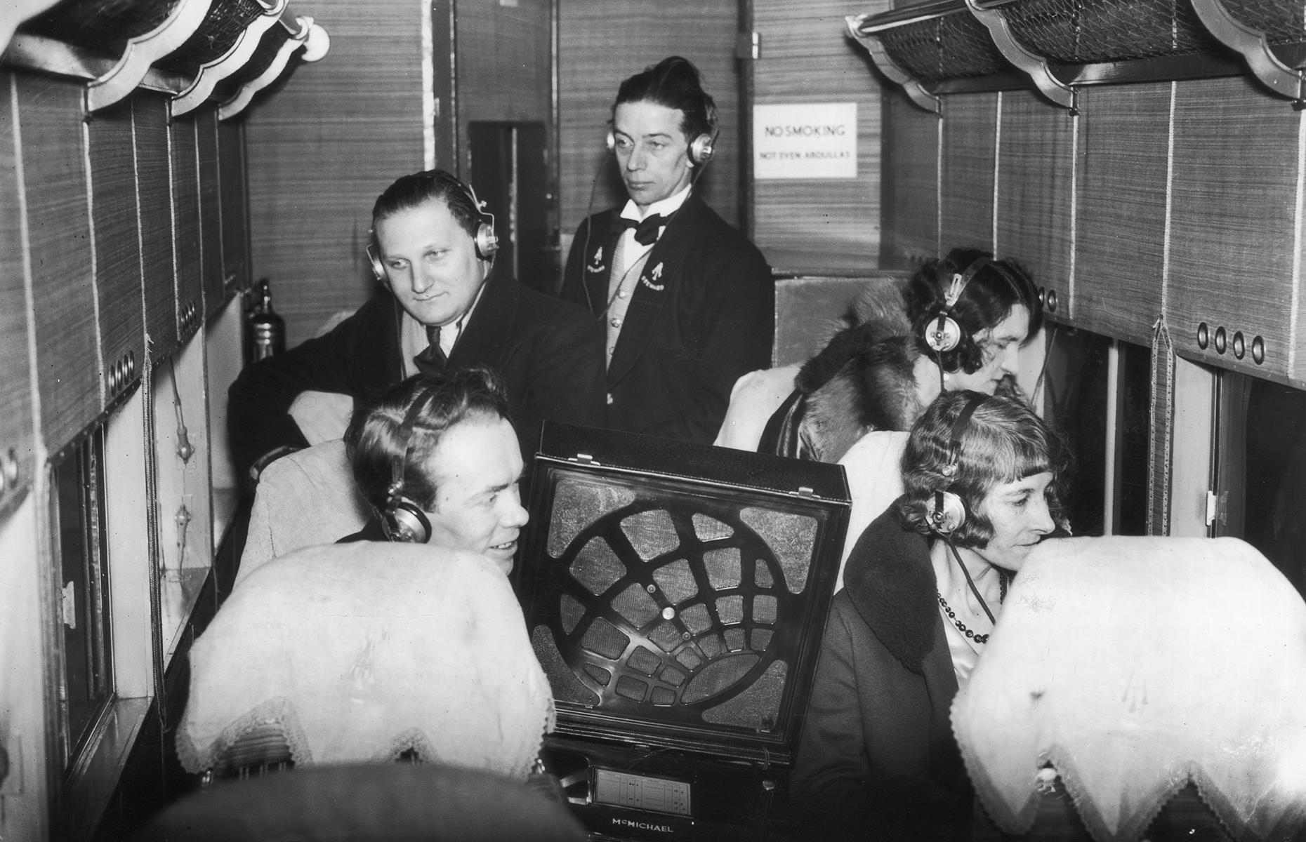 In-flight entertainment technology continued to improve too. This snap, taken in 1931, shows passengers listening to a live radio broadcast of the annual London boat race between Oxford and Cambridge universities.