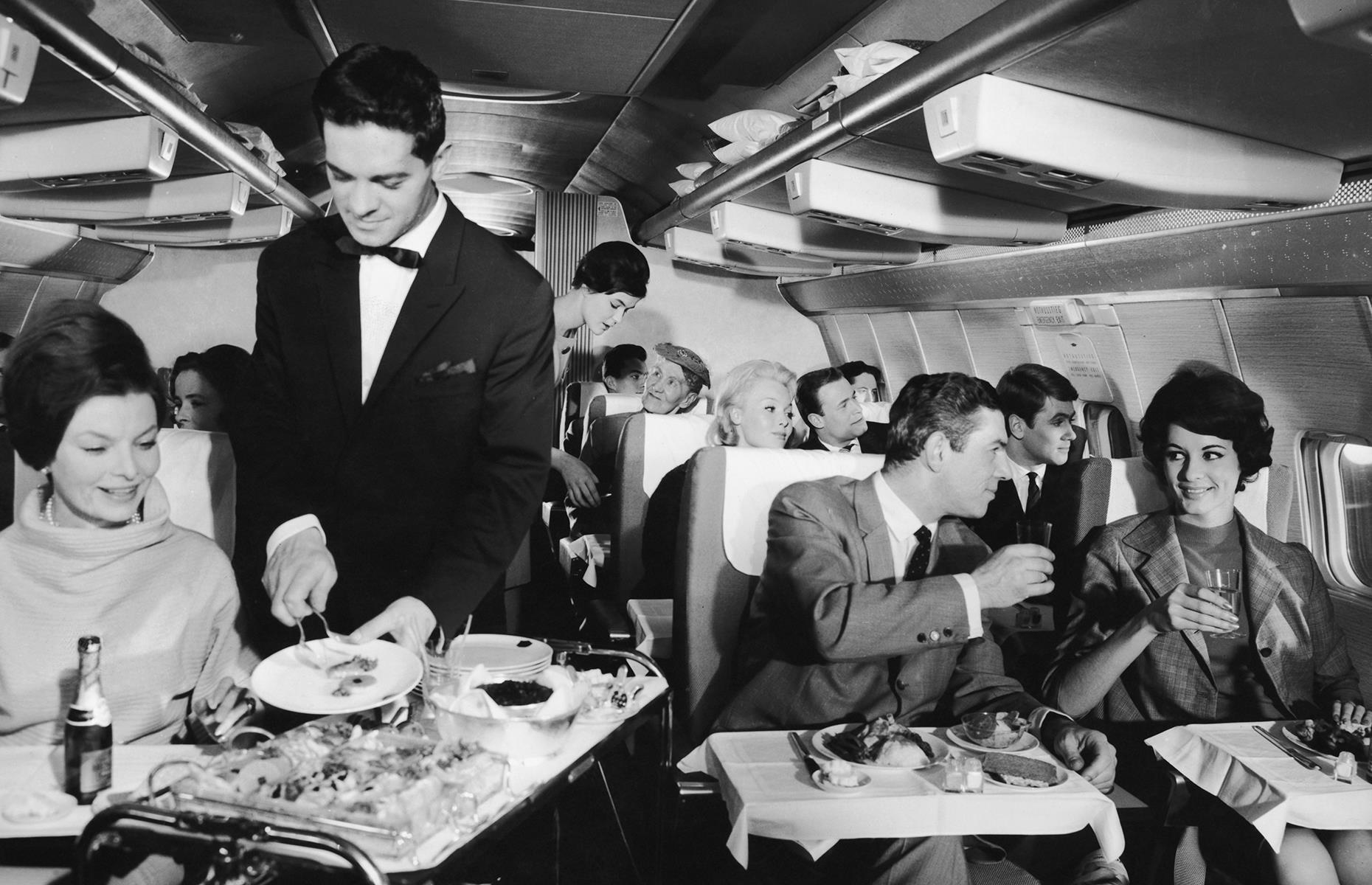<p>The golden age of travel reigned on through the 1960s and, partly since there wasn't much else to do, dinner was a grand affair. Menus often included multiple courses, bread baskets and dishes such as steak or even lobster. In this 1967 snap, passengers are being served food onboard a Lufthansa flight. Now check out <a href="https://www.lovefood.com/gallerylist/70748/the-most-decadent-airline-menus-throughout-history">the most decadent airline menus throughout history</a>.</p>