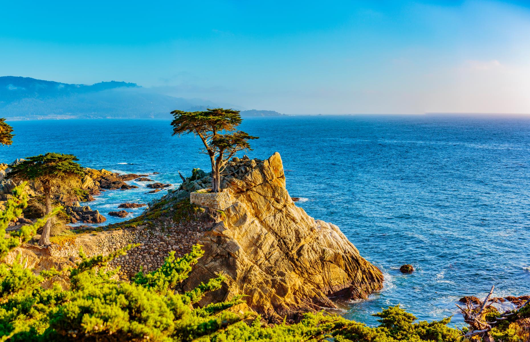 <p>Pebble Beach’s 17-Mile Drive, just north of pretty Carmel on California’s Central Coast, is a road trip within a road trip, circling off the Pacific Coast Highway. This is not a drive to rush: there’s a stop pretty much every few minutes, from beaches with harbor seals to this forlorn but noble-looking cypress tree, which occupies a solitary, salt-sprayed perch on a rock jutting over the ocean. Take a look at <a href="https://www.loveexploring.com/galleries/98482/americas-most-scenic-coastal-drives">America's most scenic coastal drives</a>.</p>