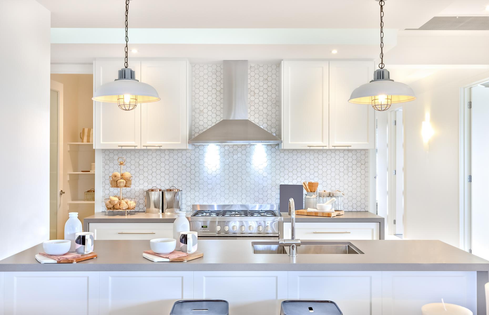<p>It's wonderful to be able to cook and entertain simultaneously and an open-plan space allows you to do that with ease. What you don't want though is for the whole room to smell of whatever you're cooking, so it's important to equip your kitchen with a high-powered range hood to whisk all those odors away.</p>