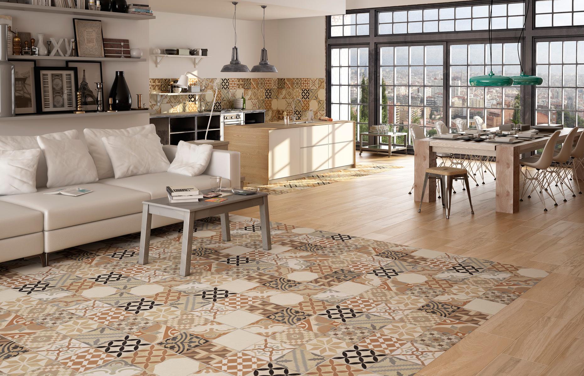 <p>A larger open-plan space allows you to <a href="http://www.loveproperty.com/gallerylist/70211/flooring-ideas">be more creative with your flooring options</a>. It's possible to mix and match different types of flooring to help separate living zones, as long as the flooring types complement each other and create a cohesive flow. Here, porcelain tiles have been used in the kitchen area, blending into warm wood floors elsewhere. The patchwork-effect floor is then repeated in the central space to define the living area. </p>