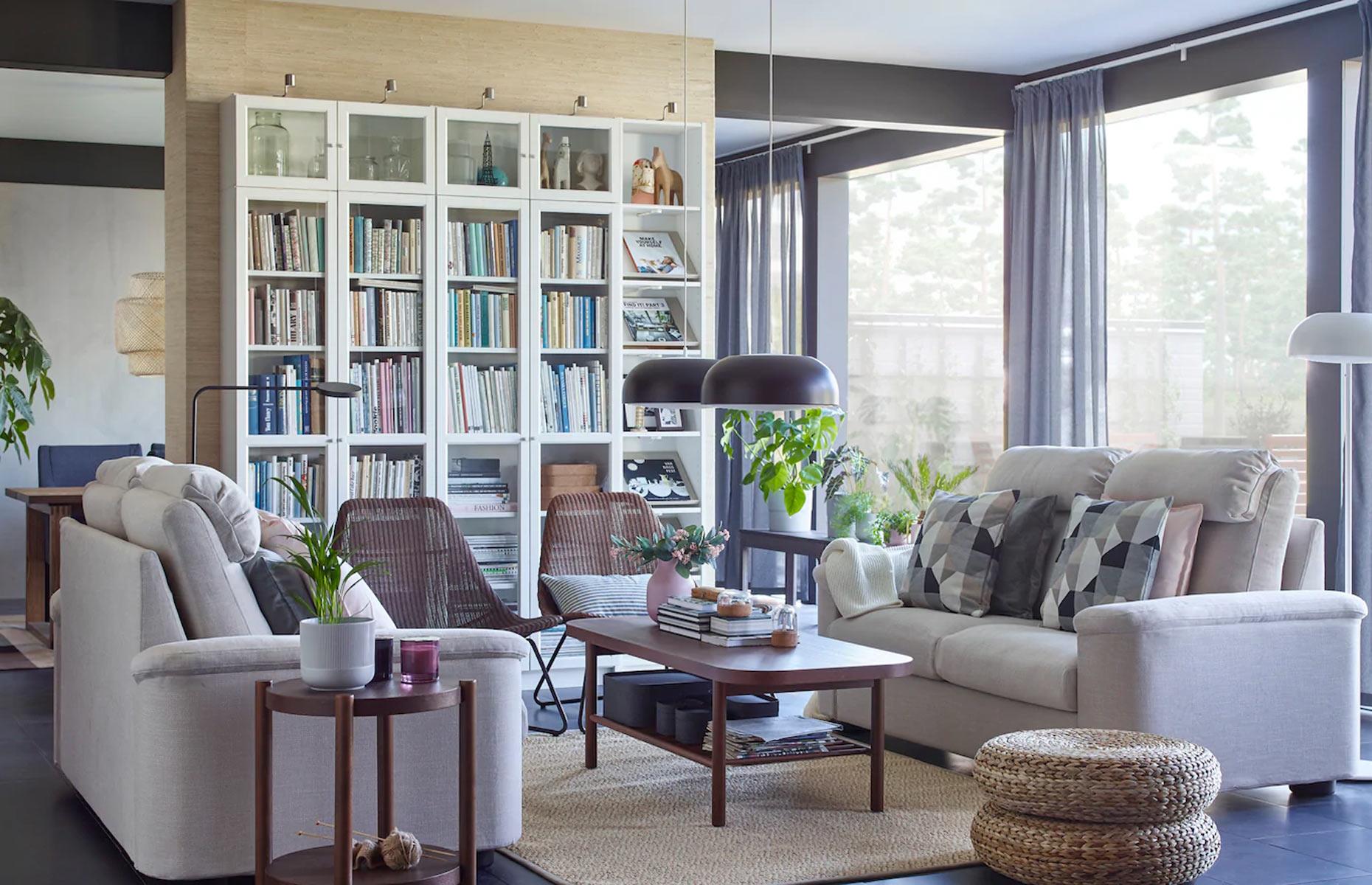 <p>Open-plan living rooms with floor-to-ceiling windows are usually light-filled and airy, however, storage space can become tricky. One solution is to place back-to-back bookshelves in the center of the room as a divider. Glass doors will keep color-coordinated books dust-free and why not install ambient lighting on top to create an atmospheric evening glow too? </p>