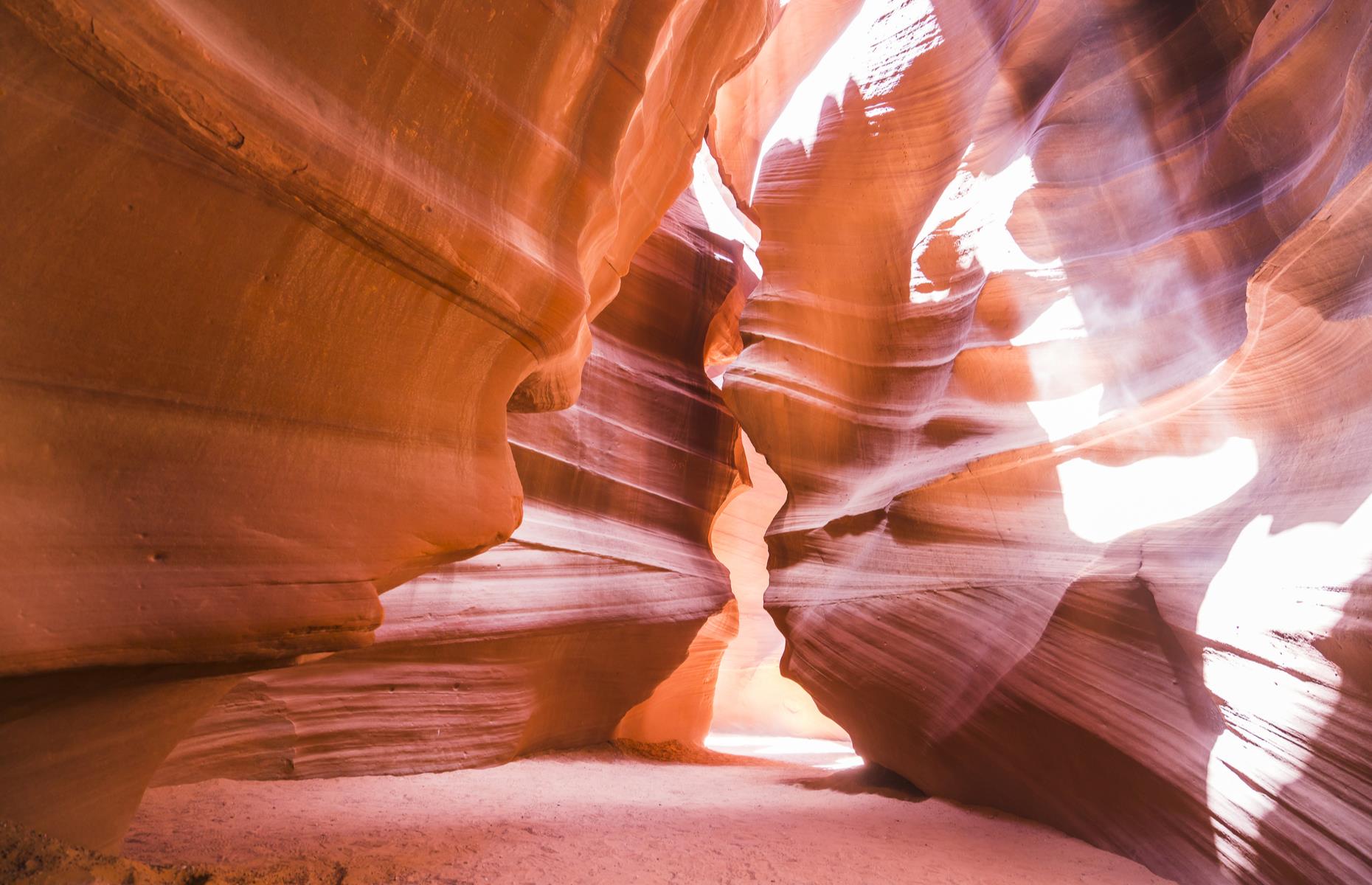 <p>With its rolling waves of vibrant red rock, Antelope Canyon looks like it could belong on Mars. Eerie beams of daylight beam through from above and cast shadows on the dusty canyon floor. The sandstone walls, which tower up to 100-feet (30.5m) high, have been sculpted into their wave-like shapes by the wind over millions of years. Usually the canyon can only be visited on a guided tour as it's located within the Navajo Nation but access is <a href="https://antelopecanyon.az/">currently closed</a> due to COVID-19. Check out these <a href="https://www.loveexploring.com/galleries/92037/stunning-images-of-the-worlds-most-incredible-canyons">stunning images of the world's most beautiful canyons</a>.</p>