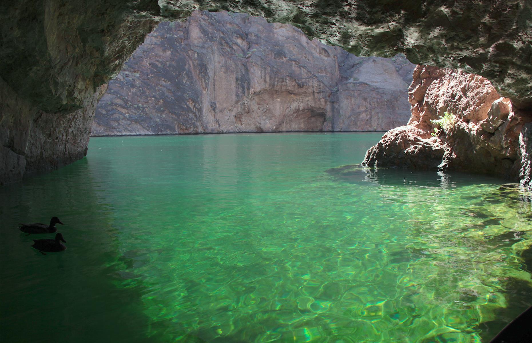 <p>The unspoiled Black Canyon is just a 45-minute drive from the bright lights of Las Vegas. Emerald Cave is the highlight here, with its vivid green sparkling water. Visitors can typically kayak through the still waters of the cove, then paddle out of the glare of the sun and into the caves that burrow into the cliff face. These are <a href="https://www.loveexploring.com/galleries/95160/americas-most-beautiful-lakes-in-pictures">America's most stunning lakes</a>.</p>