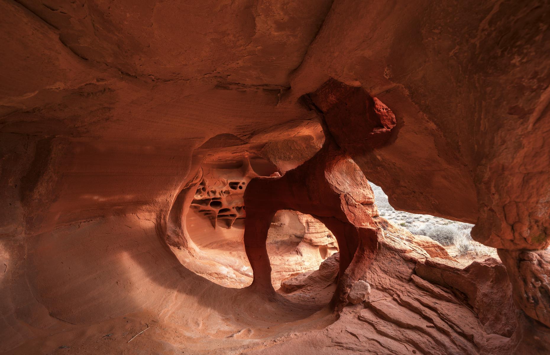 <p>This rusty red cavern is only four-foot (1.2m) wide and deep, but its vibrant color and otherworldly rock formations certainly pack a punch. Tucked away down a dirt track in Nevada’s <a href="http://parks.nv.gov/parks/valley-of-fire">Valley of Fire State Park</a>, the sandstone rock has slowly been eroded by wind, forming the Windstone Arch and alien-like shapes. If you want to see it for yourself, check the GPS co-ordinates as it isn’t easy to find.</p>