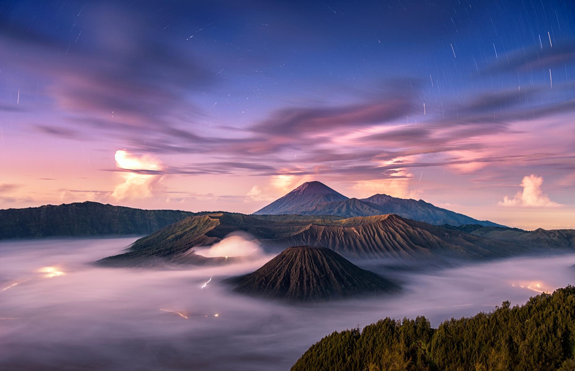 <p>Sitting on the Ring of Fire – a horseshoe-shaped area associated with most earthquakes and volcanic eruptions – at the edge of the Pacific Ocean, East Java is home to the <a href="https://www.indonesia.travel/uk/en/destinations/java/bromo-tengger-semeru-national-park">Bromo Tengger Semeru National Park</a>. This vast sandy caldera boasts the famous smoking Mount Bromo that towers and impressive 7,641 feet (2,329m).</p>