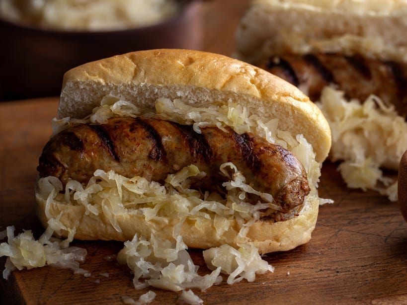 <p>This Midwestern state has a large German immigrant population, so it's no surprise that its most famous sandwich contains classic bratwurst. Eat the sausage roll topped with mustard, sauerkraut, and cheese curds — another thing for which Wisconsin is well-known.</p>