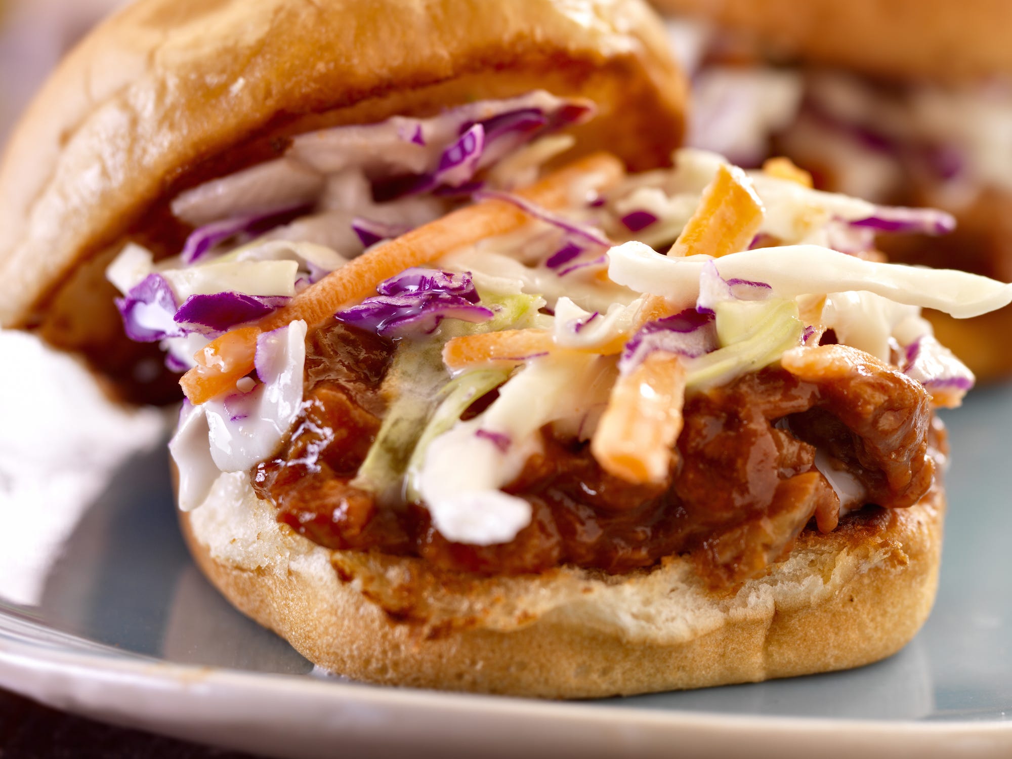 <p>Kālua-style pork is common fare at most luaus, but the slow-roasted and shredded meat is also amazing on sandwiches. Try yours with pineapple coleslaw for an extra Hawaiian punch.</p>