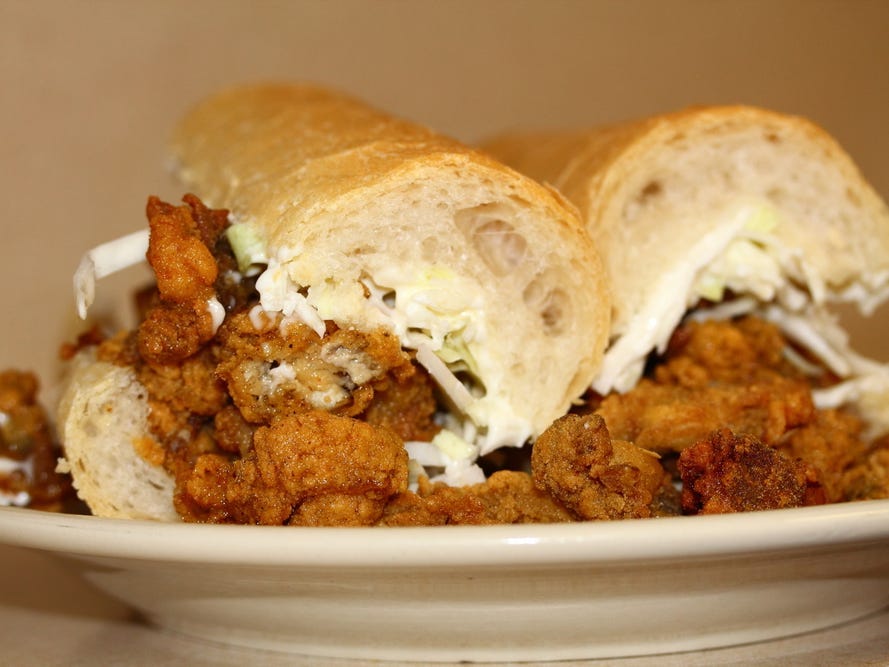 <p>The po' boy sandwich is one of Louisiana's most iconic eats. The classic sub is made with French bread and roast beef or fried seafood. A "dressed" po' boy has lettuce, tomato, pickles, and mayonnaise with optional onions and hot or regular mustard.</p>