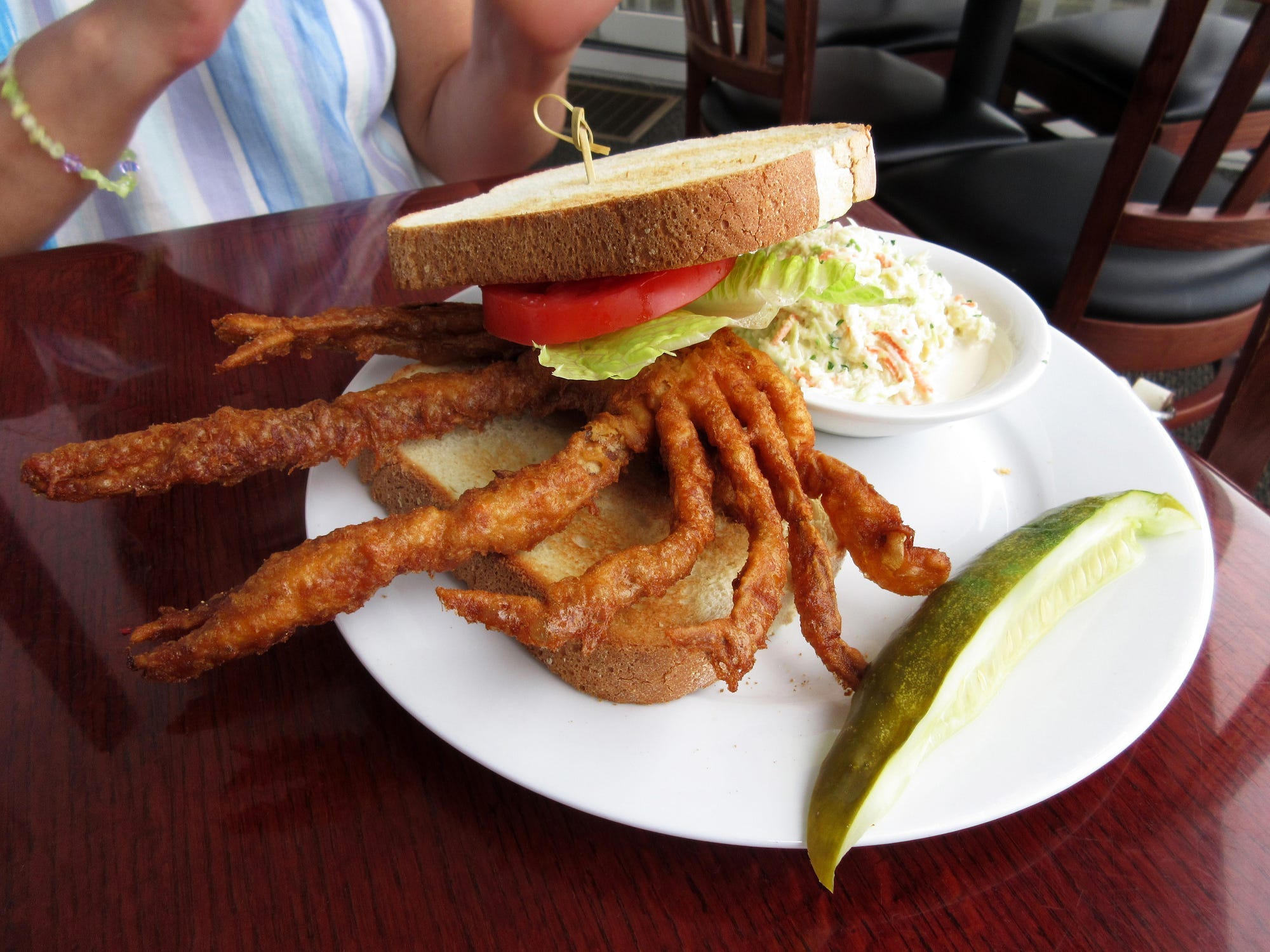<p>Anyone visiting this fishing Mecca should try a soft-shell fried crab sandwich topped with coleslaw and leafy greens. Yum.</p>