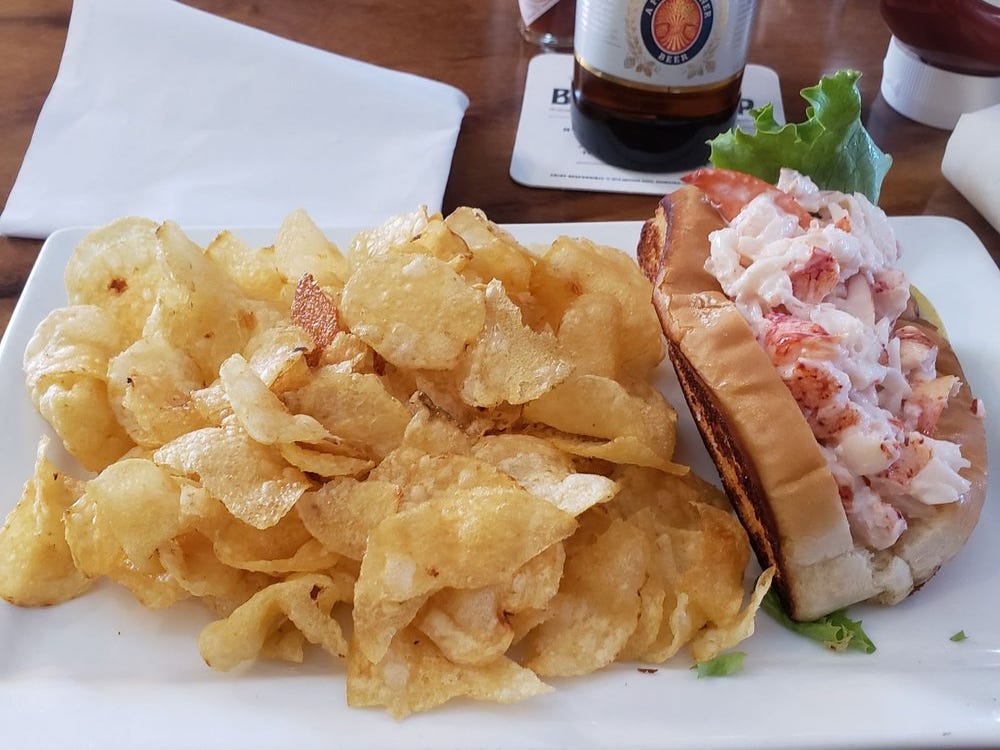 <p>What else would you order in Maine but a classic lobster roll? Served on a lightly grilled bun and filled with steamed and buttered lobster, these sandwiches taste like summer.</p>