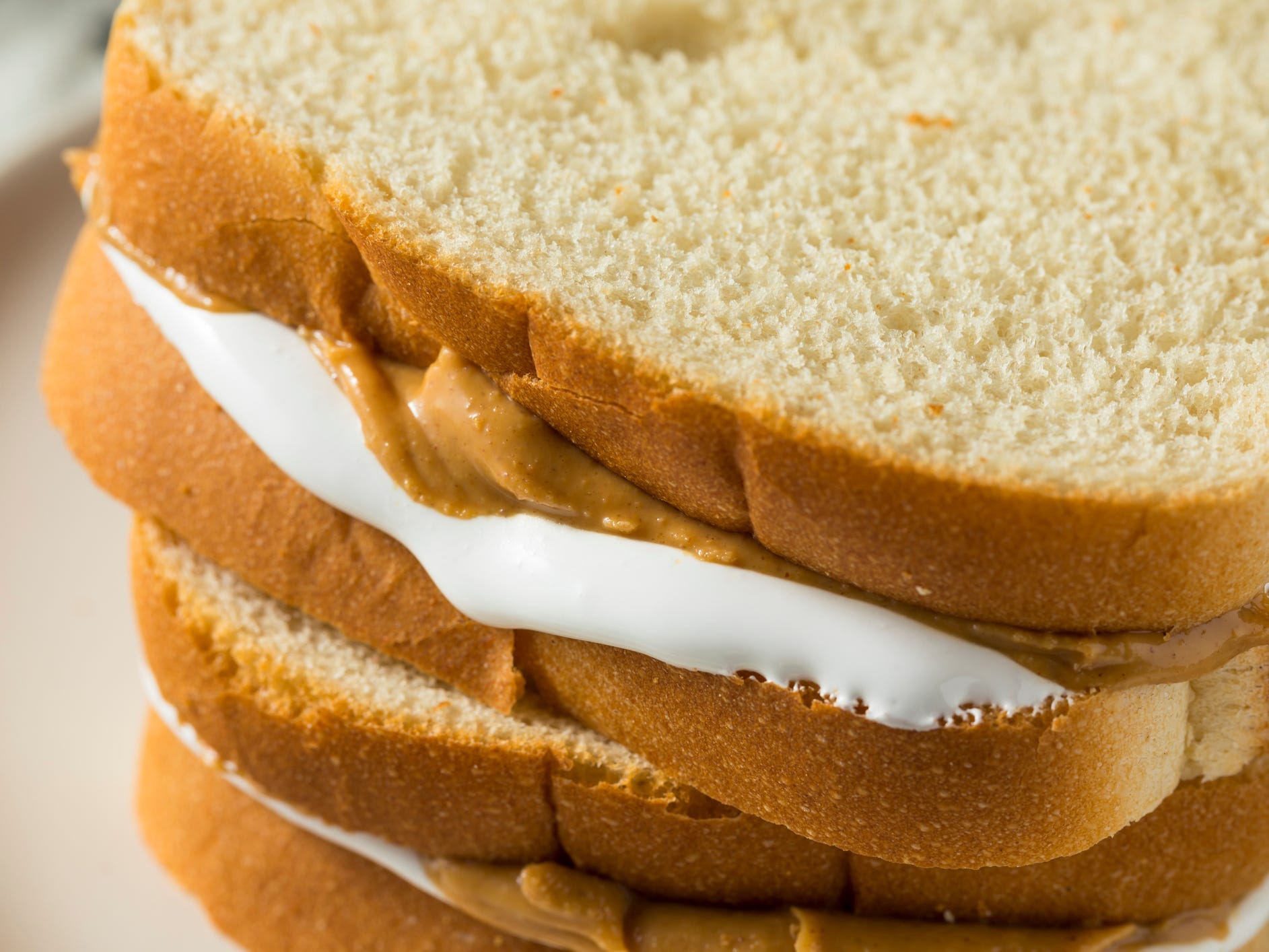 <p>If you've never tried the Fluffernutter sammie, you're missing out. It's made with soft white bread topped with peanut butter and marshmallow Fluff, which was invented by Archibald Query of Somerville, Massachusetts.</p>