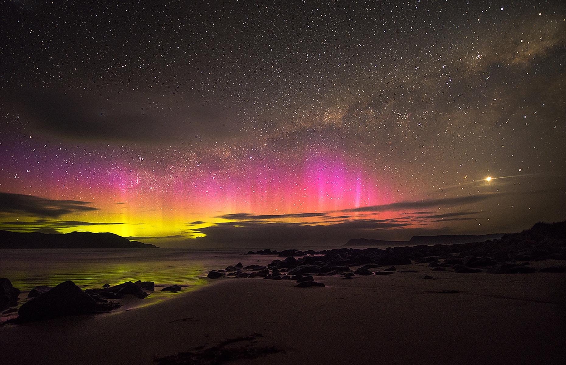 Slide 36 of 43: Most people have heard of the Northern Lights, but the dazzling show offered in the Southern Hemisphere is equally as captivating. The aurora australis, or the Southern Lights, is a dancing curtain of light that glows in every shade from pink to green. The result of energetic electrons colliding with atoms and molecules, this otherworldly multicolored show can be seen in Antarctica, New Zealand, southern Australia, Chile and South Africa.