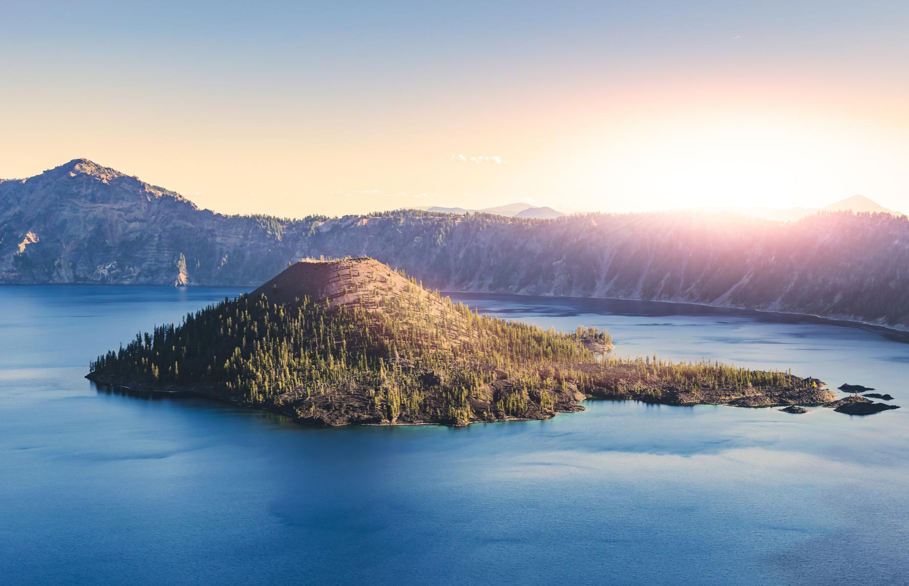 Slide 29 of 31: The lake was formed more than 7,000 years ago and is a collapsed volcano filled with rain and snowmelt. The cinder cone-shaped Wizard Island which rises in its center makes it even more distinctive. Now take a look at the most wonderful views in the world.