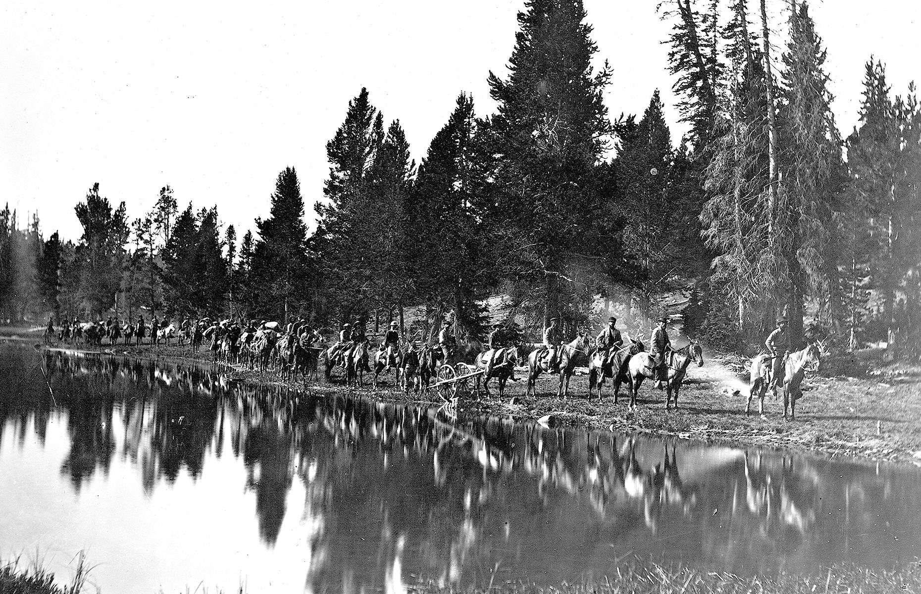 <p>The first National Park in the US, Yellowstone was established in 1872 and covers a large region in northwestern Wyoming as well as Montana and Idaho. This photograph was captured prior to its official founding and shows men carrying out the Hayden Geological Survey of 1871. Tourists began to visit by rail or horse and carriage from the late 1800s, although it wasn’t until cars were allowed in 1915 that tourism really spiked. For thousands of years, Yellowstone has been home to indigenous people and today 26 tribes have ties to the area.</p>