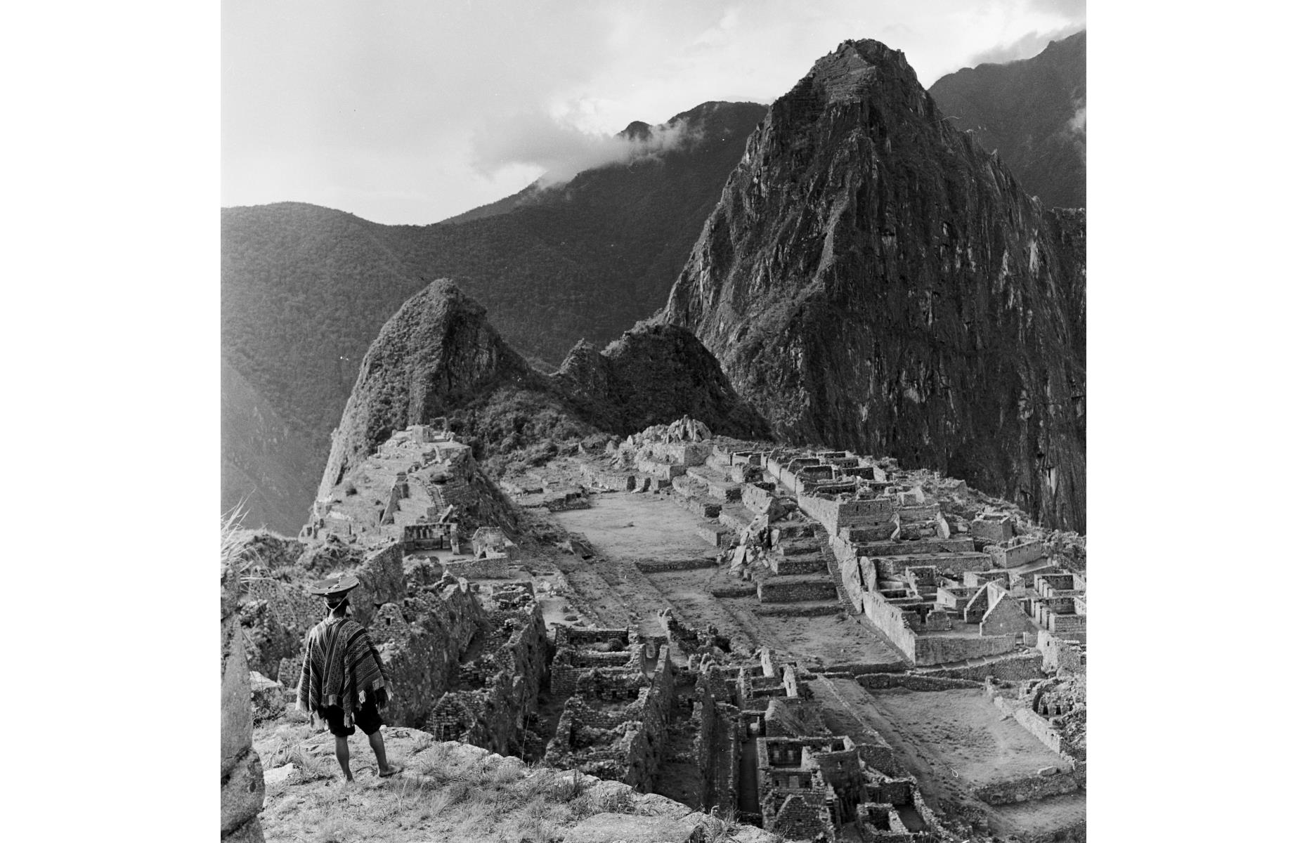 <p>A well-preserved citadel dating back to the Inca Empire which ruled over western South America in the 15<sup>th</sup> and 16<sup>th</sup> centuries, Machu Picchu is located around 50 miles (80km) northwest of Cuzco, between the peaks of its namesake and Huayna Picchu. It became well-known to the Western world when American archaeologist Hiram Bingham and his team began digging there in 1911, after which Bingham published a book, <em>The Lost City of the Incas</em>, which led tourists to flock to the Inca Trail. Pictured here in the mid-1950s, a Peruvian Indian man in traditional dress gazes out at the view.</p>