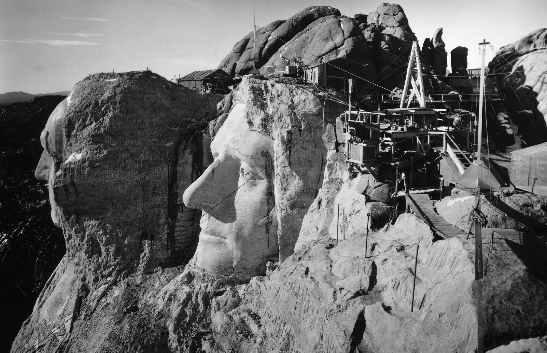 <p>The monument to four presidents of America – George Washington, Thomas Jefferson, Theodore Roosevelt and Abraham Lincoln – was carved into the rock in South Dakota’s Black Hills region between 1927 and 1941. Pictured here during construction in 1940 is the profile of Jefferson and the outline of Washington in the distance, as seen from the top of Lincoln's head. Today, Mount Rushmore is a popular landmark usually receiving around two million visitors a year. <a href="https://www.loveexploring.com/galleries/92983/hidden-secrets-of-americas-tourist-attractions?page=1">Check out the hidden secrets of this and other American tourist attractions here</a>.</p>