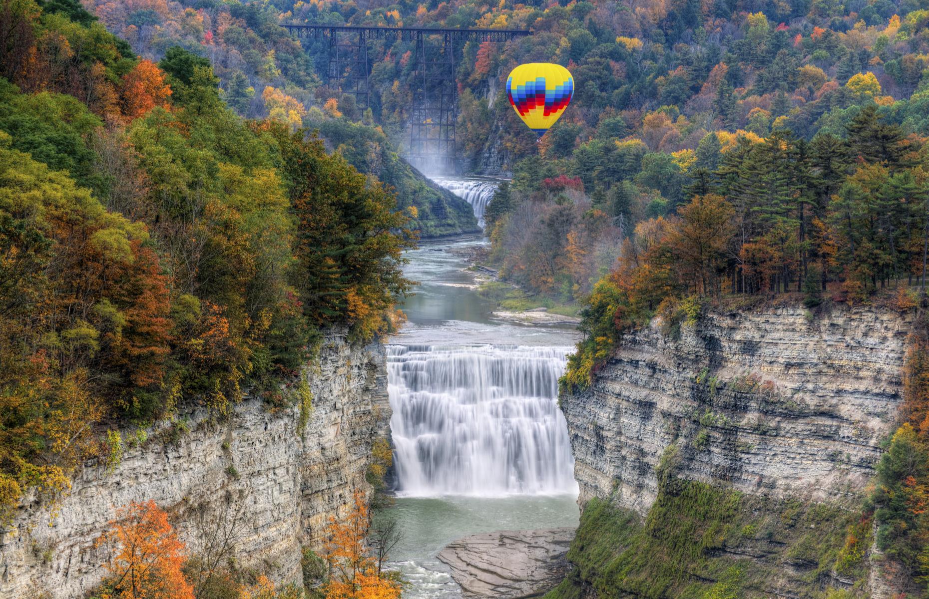 Slide 15 of 49: While visitors crowd the vantage points at Niagara, you can typically expect a little more elbow room at Letchworth (pictured). Less than two hours' drive from Niagara Falls, Letchworth State Park boasts its own impressive set of cascades – at their highest, the waterfalls reach 600 feet (183m), rushing over craggy cliff faces and cloaked by lush woodland. The site still gets pretty busy in summer, but come in late fall or even winter and you'll likely have pockets of the pretty park to yourself. Note that it's currently operating at reduced capacity in order to maintain social distancing – see the NY Parks website for details. 