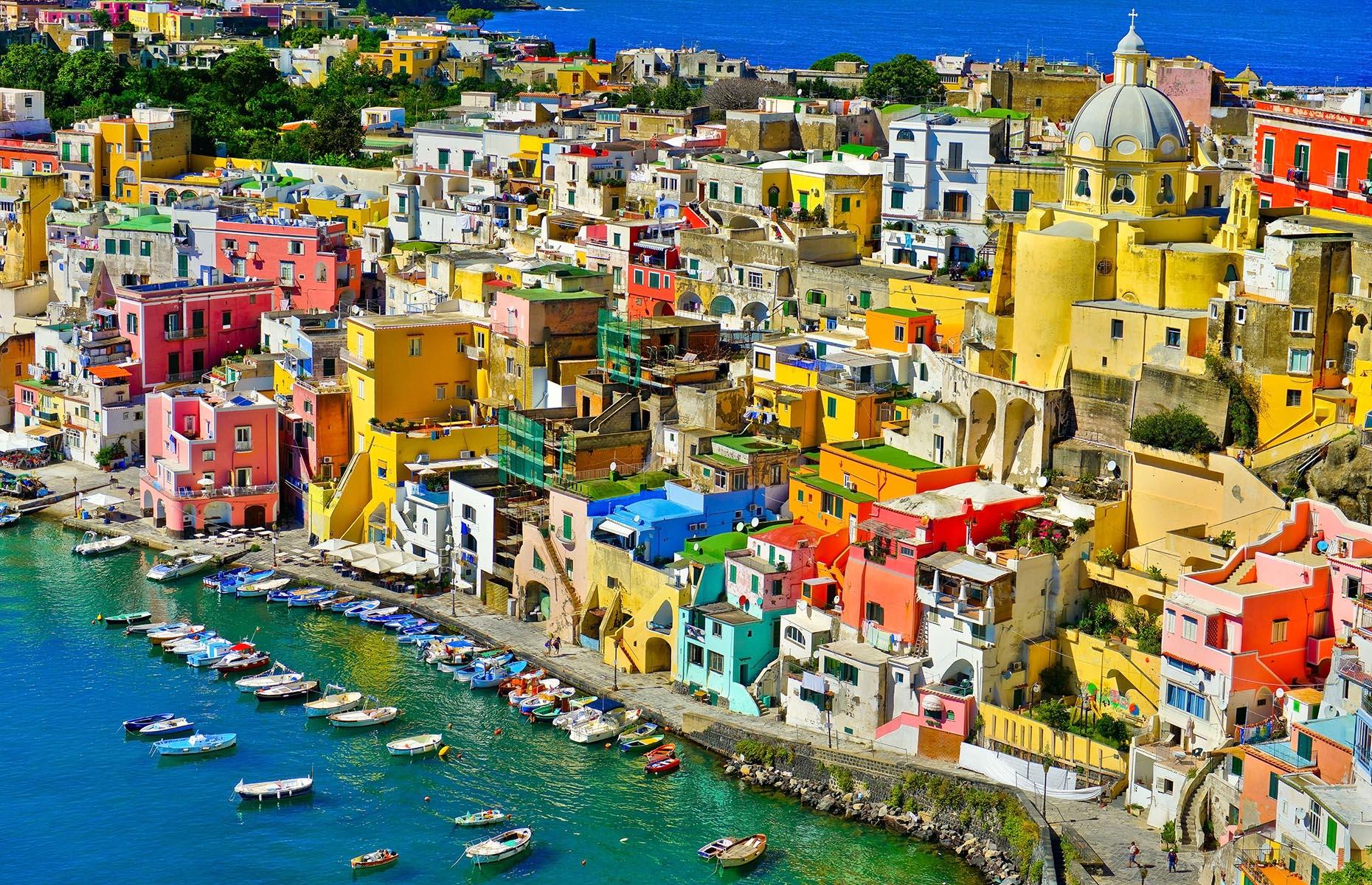 Slide 41 of 41: The town of Procida spans the whole island from which it gets its name. It’s the Bay of Naples’ smallest and sweetest island, much quieter than neighboring islands, such as Capri. Littering the seaside are houses drenched in dazzling shades of pink, blue, yellow and more, their peeling paintwork adding to the effortless Italian charm. Now take a look at the world's most colorful natural wonders