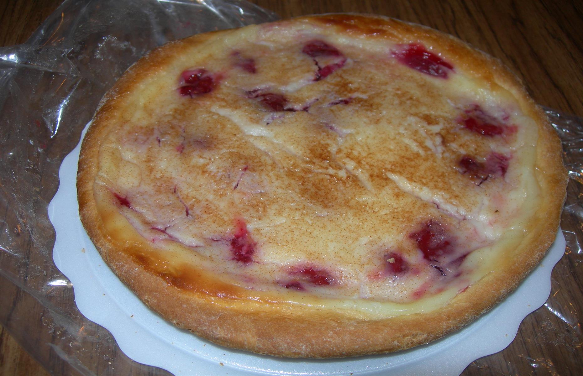 <p>This variety, often referred to as a dough pie, was <a href="https://statesymbolsusa.org/symbol-official-item/south-dakota/state-food-agriculture-symbol/kuchen">named the official state dessert</a> in 2000 and is based on recipes <a href="https://www.southdakotamagazine.com/cooking-kuchen">introduced by German settlers in the 1880s</a>. Its heritage is celebrated at festivals across the state, while many bakeries still specialize in kuchen. Other popular styles of kuchen include one with a cake-like crust and apple filling, pastries with cinnamon and sugar, and cheesecake-style with cherries and custard.</p>