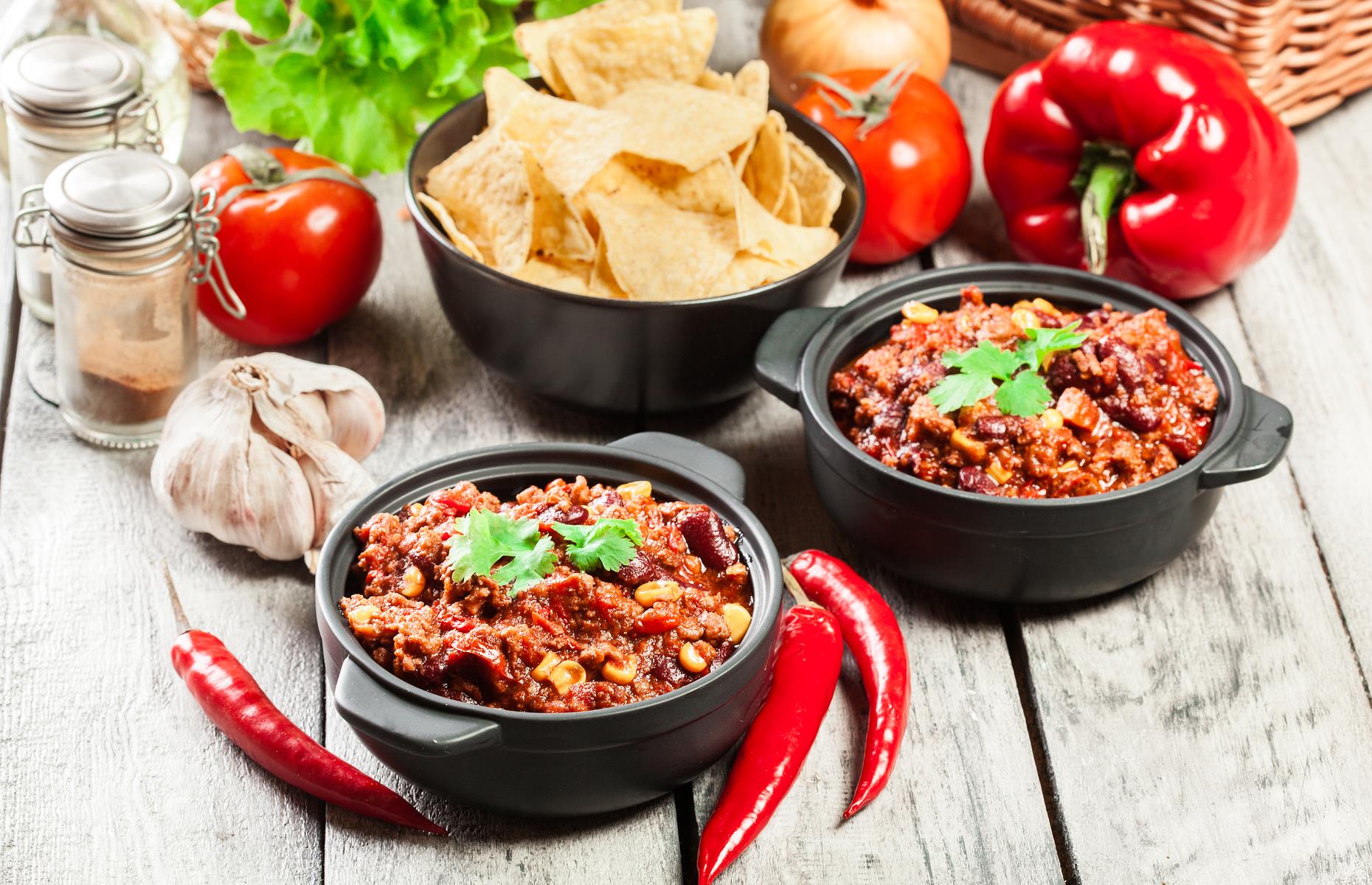 <p>A spicy, smoky ‘bowl o’red’ became Texas’ official meal in 1977, declared by the state legislature. The <a href="https://www.nationalchiliday.com/chili-history.html#.X0Jv_ZNKgUs">origins of chili</a> have been hotly debated, with some arguing it’s based on Mexican cuisine and others suggesting it was brought over from the Canary Islands. The Texan dish, though, was famously ladled out in a San Antonio market by so-called ‘chili queens’ in the late 19th-century, becoming a tourist attraction and spawning chili joints throughout the state.</p>