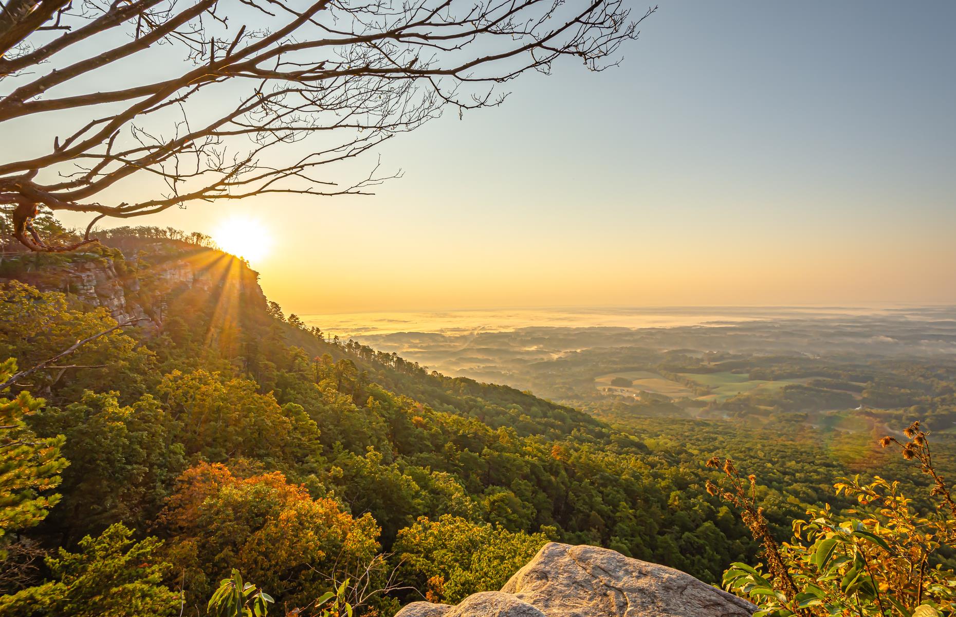 <p>The pine-capped crest of this mountain peeps above a thick cloak of forested slopes and can be viewed from much of North Carolina’s Yadkin Valley. The vistas are even better from up here. Visitors can park below the summit to stare down across the vine-striped valley to the Sauratown Mountains and Hanging Rock. It's best to go when <a href="https://www.ncparks.gov/pilot-mountain-state-park/home">Pilot Mountain State Park</a> opens, in time for the lilac and pink sunrise. It's definitely worth getting up early for. Now find <a href="https://www.loveexploring.com/galleries/70672/sunrise-pictures-the-top-spot-in-every-us-state">the top sunrise spot in every state</a>.</p>