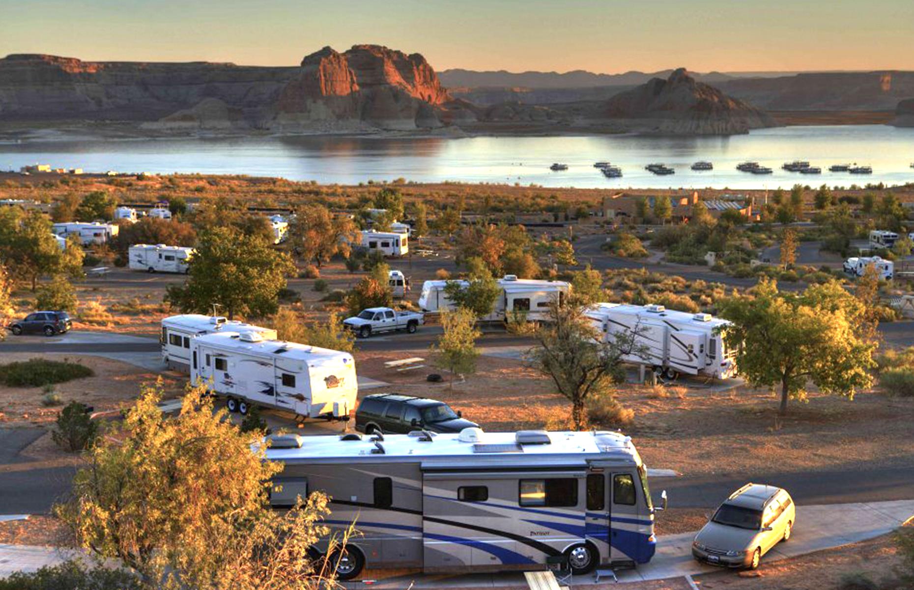 <p>Straddling the border between Utah and Arizona, Lake Powell is a freshwater reservoir backed by canyons and colorful striped rock formations. For that sweet spot between location and convenience, <a href="https://www.lakepowell.com/rv-camping/wahweap-rv-campground/">Wahweap Marina’s RV site</a> is tough to beat. There are electric hook-up sites, showers and shops, plus restaurants within walking distance. But there’s no compromising on the eye-popping views.</p>