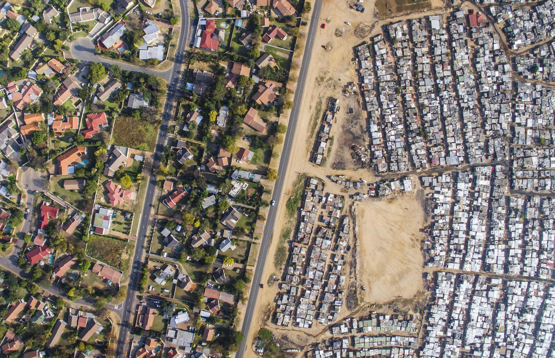 South Africa was named as the most unequal country in the world in 2018 by a World Bank report. Despite the end of Apartheid in 1994, since 2011 at least 2.5 million South Africans have fallen into poverty. This can be seen in images such as this one, taken over  Johannesburg, where the Kya Sands slum faces the affluent, leafy suburb of Bloubosrand. Large houses with swimming pools are separated by just a single-track road from the poverty of the tin-roofed shacks.
