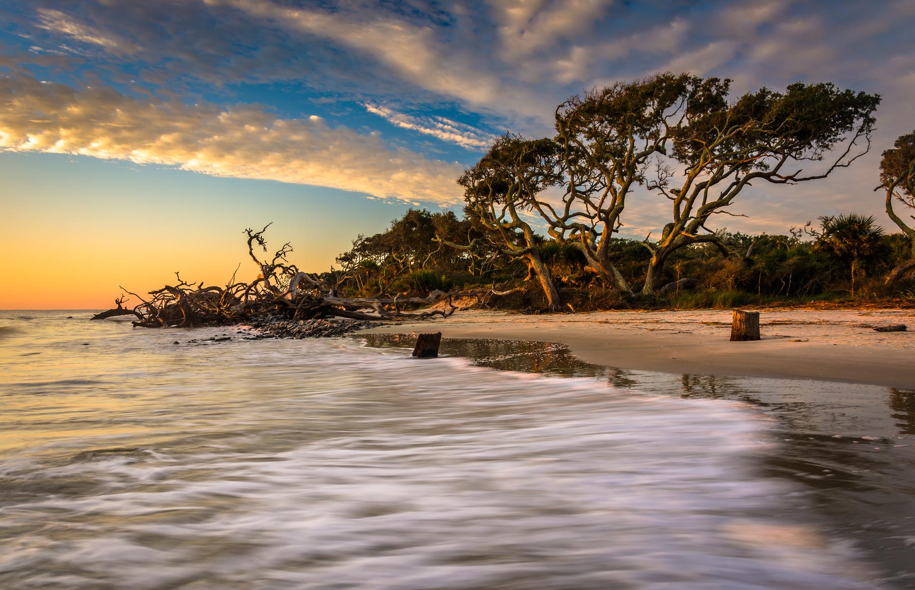 <p><a href="https://www.jekyllisland.com/">Jekyll Island</a>, an easy, scenic drive along a coastline laced with beaches, marshes and barrier islands, packs up the same charm and elegance and takes it to the seaside. One of Georgia’s Golden Isles, it’s accessible by car but feels cut off from the rest of the world. Windswept oaks and tangles of driftwood form a backdrop to soft-sand beaches, while trails wind into the woods.</p>