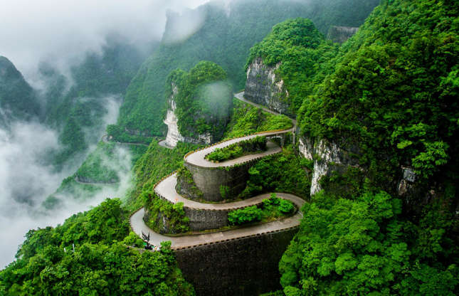 Slide 2 of 31: Snaking around the Tianmen Mountain in the Hunan Province of central China, this deadly-looking road is also known as the 99-Bend Road, for the fact it contains a whopping 99 twists and turns spread across seven miles (11.3km). For visitors wishing to keep their breakfast down, a cable car typically operates between City Garden downtown and the mountain’s summit.