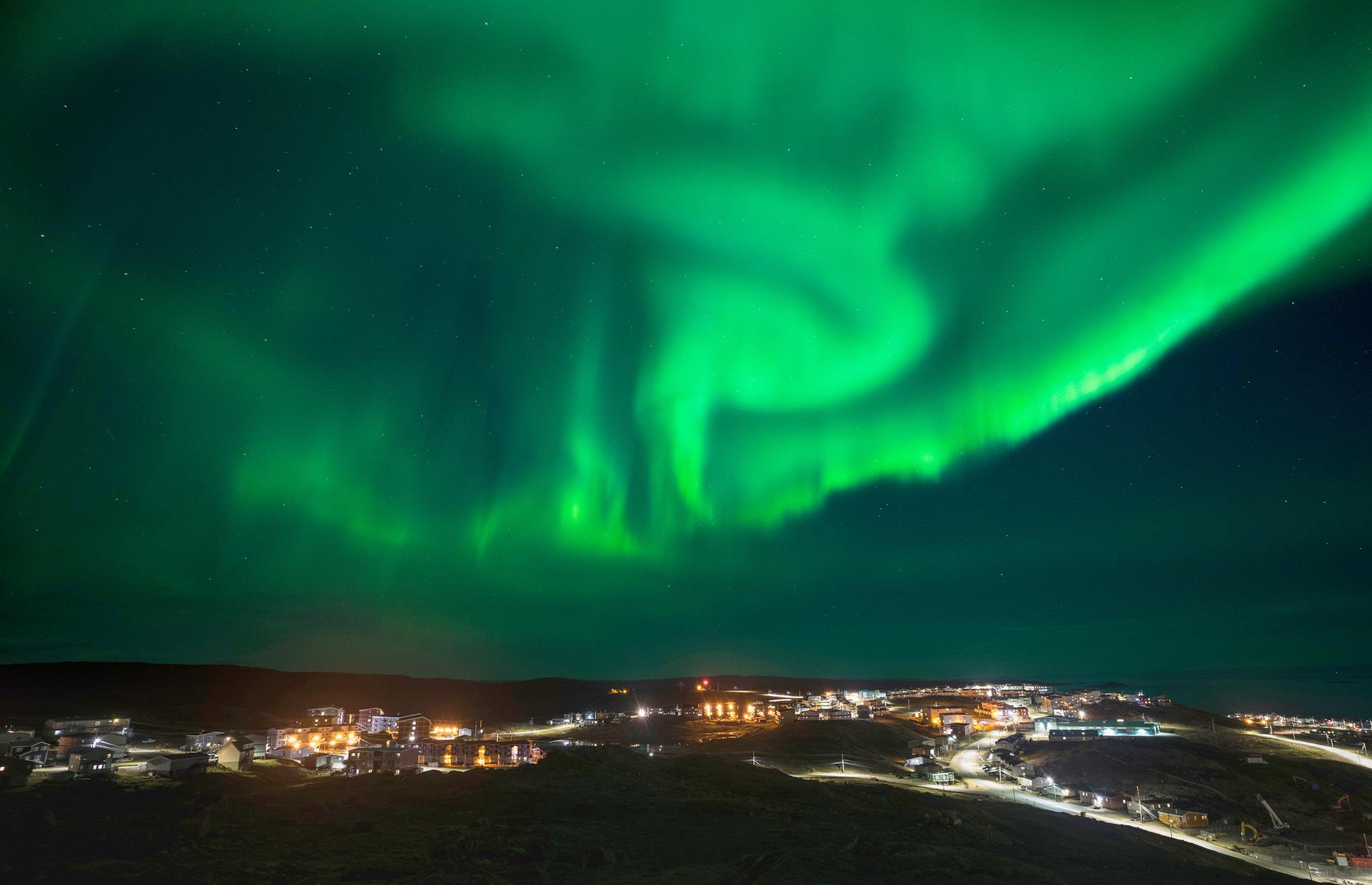 Slide 12 of 31: It’s not uncommon to see the Northern Lights dancing overhead in Iqaluit, the capital and sole little city in Nunavut. It occupies a stomach-flipping spot on the waterside on Baffin Island, hemmed in by a trio of parks, filled with forests, waterfalls and archaeological wonders. Iqaluit is also known for its Inuit culture, with a thriving arts and crafts scene and typically two popular festivals. See more stunning images of the Northern Lights here.