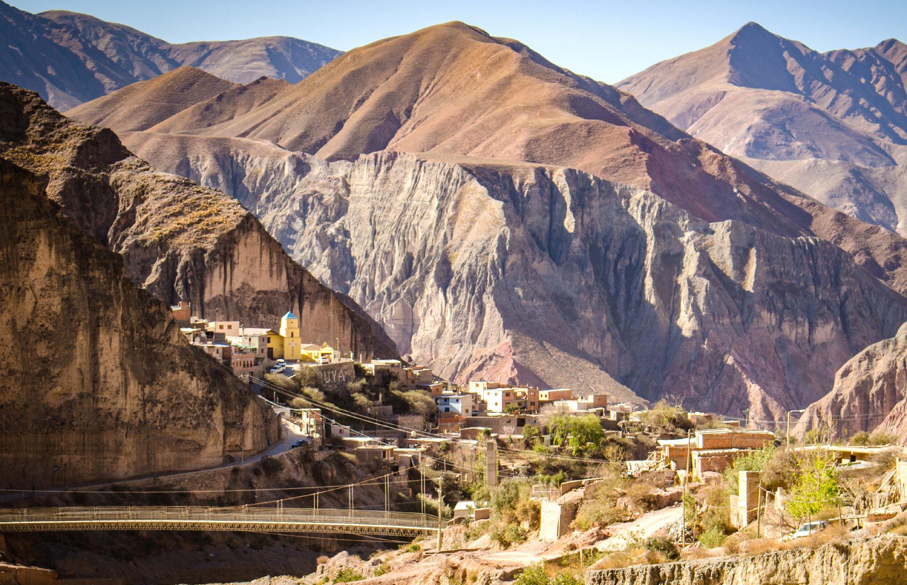 Slide 8 of 31: A narrow gravel road carved into a mountainside leads to Iruya, a lofty village that peers out from the peaks. It’s set at around 9,000 feet (more than 2,700m) in the Altiplano region and it’s known for its pastel buildings, its hiking trails, its historic church and, of course, the heart-stopping mountain panoramas.