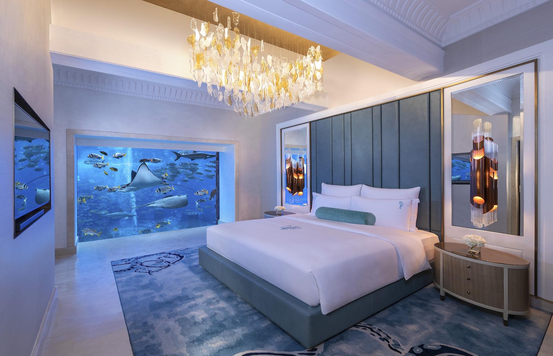 <p>Standing out from the crowd in Dubai's ostentatious hotel scene is quite a feat but <a href="https://www.atlantis.com/dubai/atlantis-the-palm">Atlantis, The Palm </a>hotel does exactly that. Among the 1,500-plus rooms of this palatial hotel lie two underwater suites, aptly named Poseidon and Neptune, where guests can sleep next to a vast fish-filled lagoon while lapping up every conceivable luxury.</p>