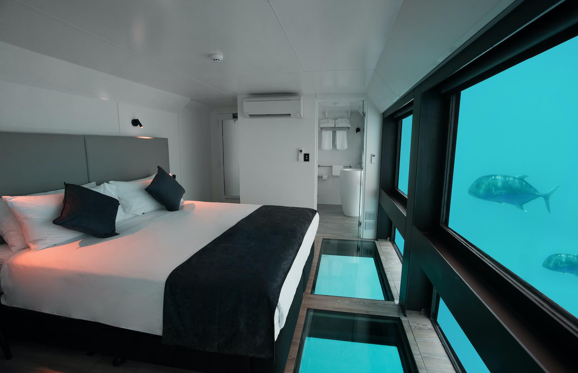 <p>If you thought sleeping inside a giant aquarium was extraordinary, how about bedding down in the world’s largest tropical coral reef? Two new glass-walled hotel suites have opened beneath the waves of Australia's Coral Sea, offering marine lovers a window onto the myriad wonders of the Great Barrier Reef. Billed as Australia’s first underwater hotel, <a href="https://cruisewhitsundays.com/experiences/reefsuites/">the Reefsuites</a> opened in December 2019 just off Hardy Reef near the Whitsundays archipelago. </p>