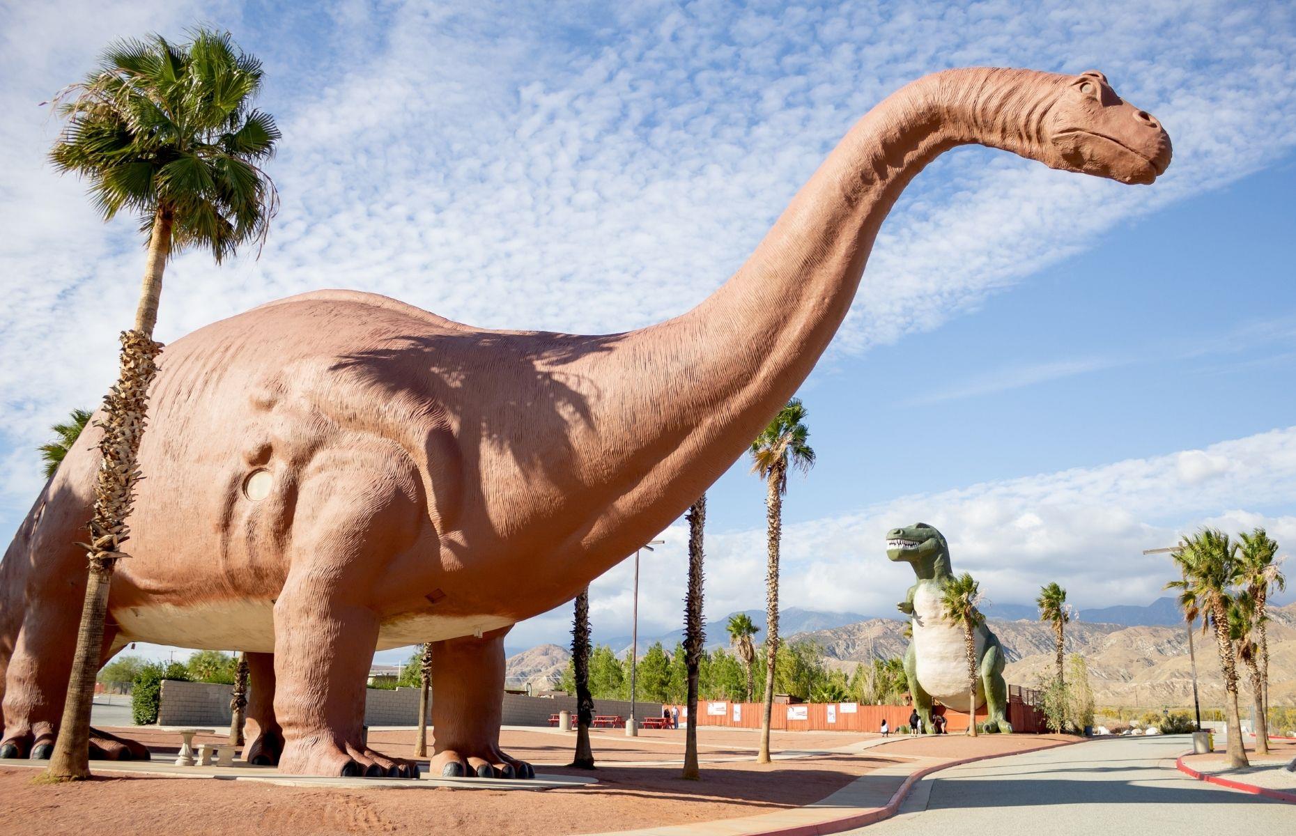 <p>Fun for the whole family, <a href="https://www.cabazondinosaurs.com/">Cabazon Dinosaurs</a> is one of America's most iconic roadside attractions. Located in the heart of a desert landscape in California, its outdoor trail features two towering dino models Dinny the Dinosaur and Mr Rex. The attraction opened in 1975 and has appeared in movies including <em>Pee-wee's Big Adventure</em>. It also boasts the <a href="https://www.sweetosaur.com/wafflesaurus-truck">Wafflesaurus Truck</a>, which serves delectable dinosaur-themed treats to top off your trip. </p>