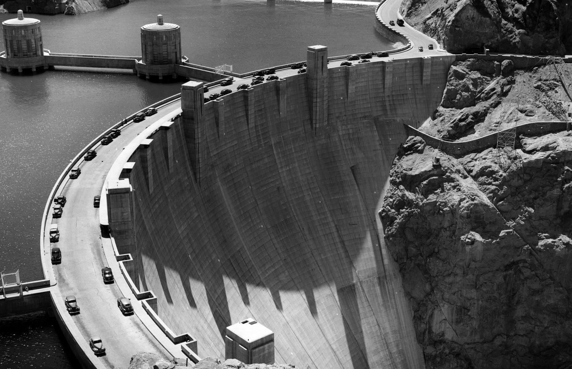 Built between 1931 and 1936, during the Great Depression, to tame the Colorado River, the mighty Boulder Dam on the Arizona-Nevada border was the largest in the world. Its reservoir Lake Mead remains the largest in the world. It opened for tours in 1937 and became a popular tourist destination. It was officially renamed the Hoover Dam by the then-president, Herbert Hoover, in 1947. It was designated a National Historic Landmark in 1985 and a new visitor center was built in 1995.