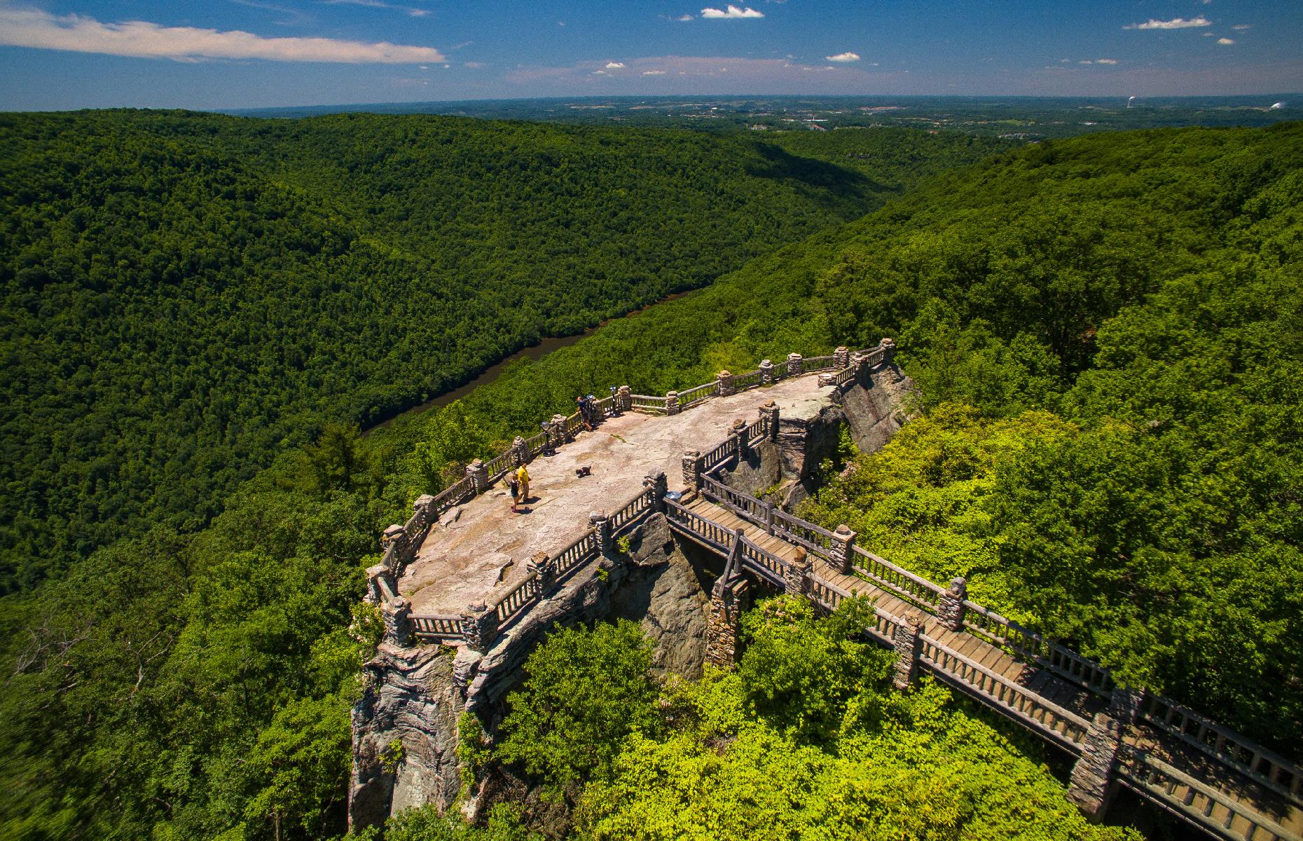 <p>West Virginia's strapline is "Almost Heaven", a nod to the 1970s John Denver track – and in the midst of the <a href="https://wvstateparks.com/park/coopers-rock-state-forest/">Coopers Rock State Forest</a> it's not hard to see why. The eponymous Coopers Rock is a knot of mighty sandstone bluffs, and the entire park extends over around 12,747 acres. Popular things to do include hiking the many scenic, wooded trails, skiing in season, and overnighting at one of the site's 25 campgrounds.</p>