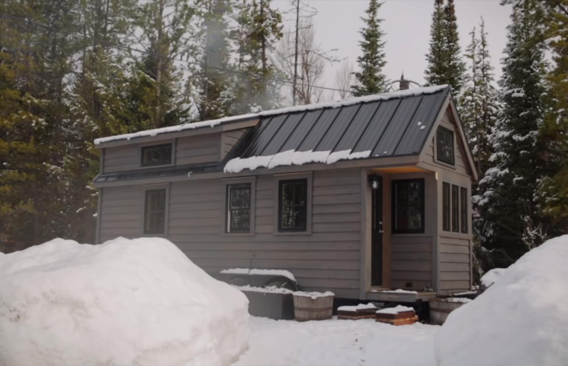 <p>This miniature cabin on wheels belongs to <a href="https://fynyth.blogspot.com/">Ariel McGlothin </a>and is nestled way up in the Wyoming mountains. She shared her minimalist off-grid lifestyle in a <a href="https://www.youtube.com/watch?v=84mKsMtb_bQ">video tour</a> with filmmakers from <a href="https://www.tinyhouseexpedition.com/">Tiny House Expedition</a>.</p>