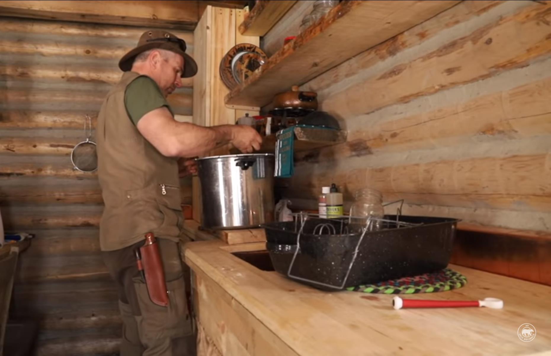 <p>Shawn harvests maple sap from the surrounding trees using metal 'spiles'. He has acquired a complex knowledge of the exact time and temperatures for the best harvest and says the sweet liquid can be drunk straight from the tree. He boils the sap down over an open fire to make his own maple syrup, which he then stores in jars.</p>