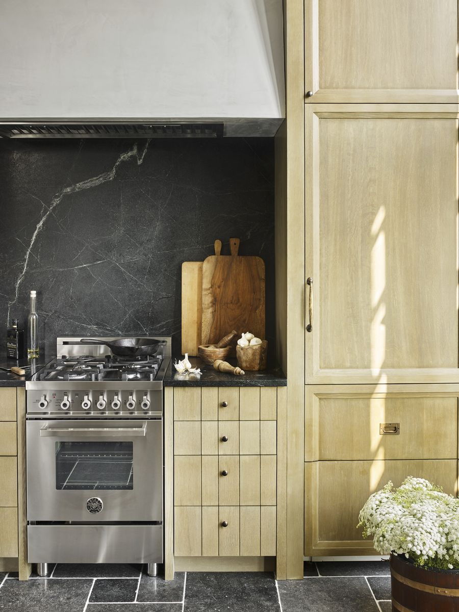 <p>In this South Carolina kitchen, architect Peter Block and designer Beth Webb clad the counter-depth refrigerator and freezer in the same rift-cut white oak panels, as the cabinetry creates a more seamless look, which is all the more important in a small kitchen. The slender range by <a href="https://us.bertazzoni.com/">Bertazzoni</a>.</p>